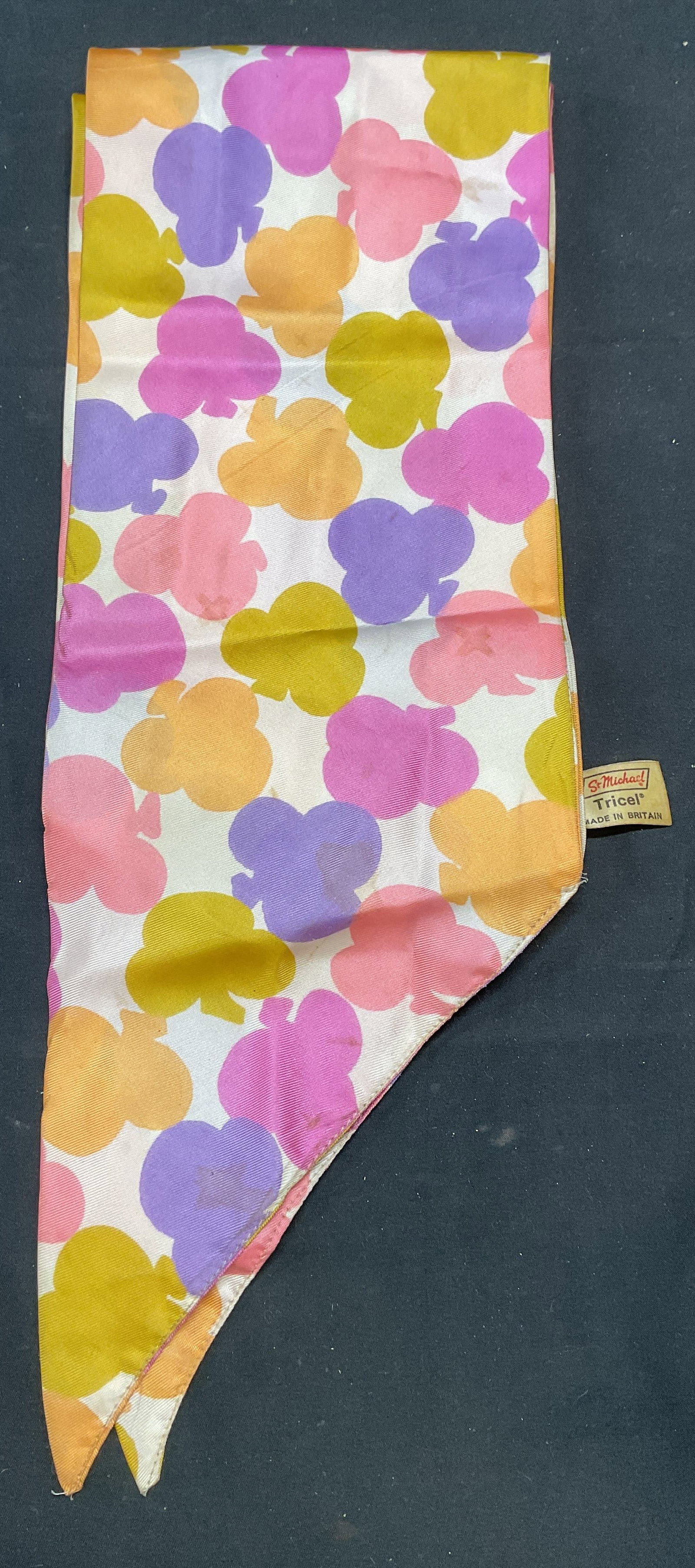 Vintage St Michael Purple Clover Scarf, Gr Britain: Vintage St Michael graphic clover print scarf in purple, pink, green, and white. Tricel. Made in Great Britain. Measures approx. 54 inches long. Some wear to material including blemishes observed. Sca