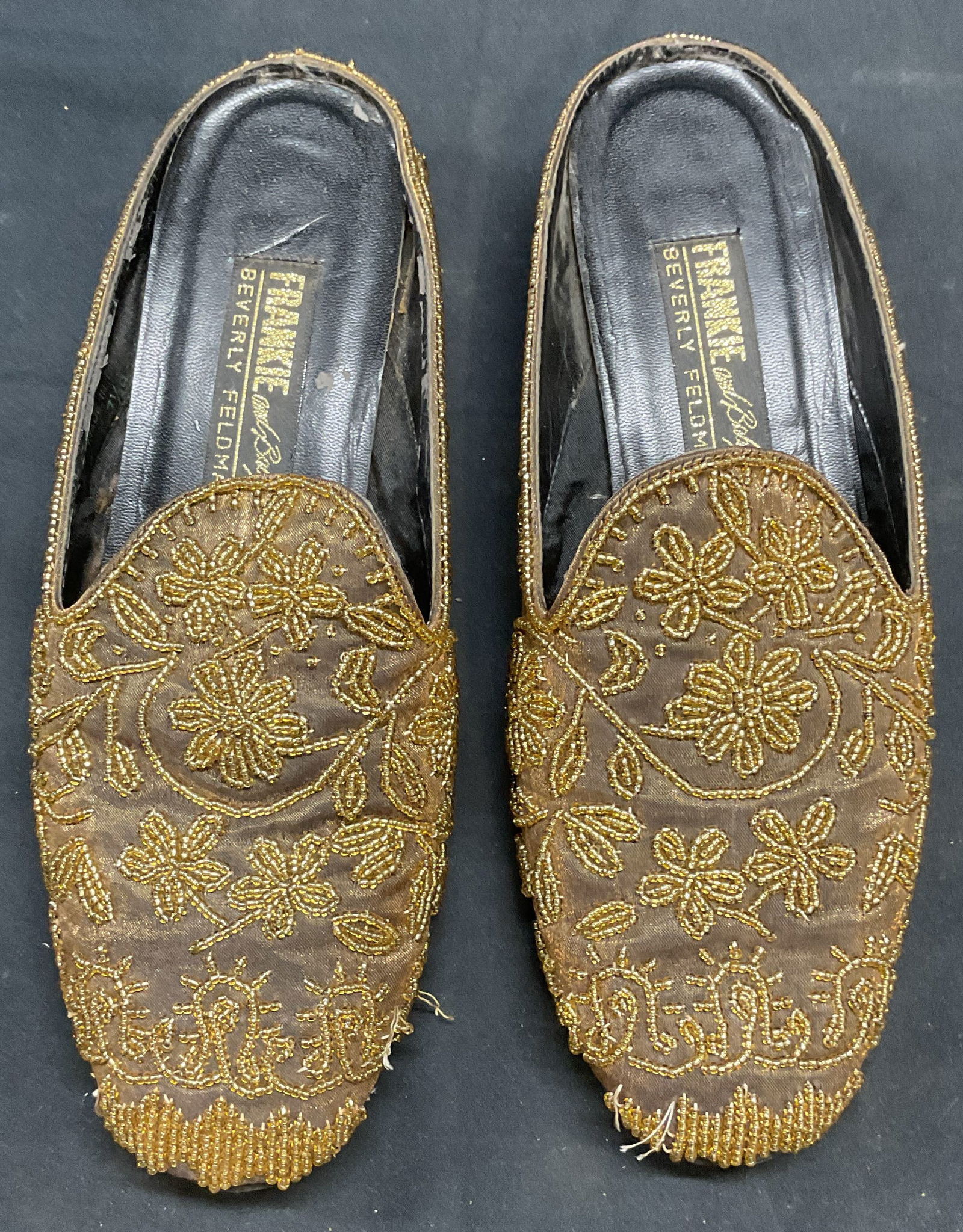 Vtg Frankie & Baby Beverly Feldman Beaded Mules: Vintage Frankie and Baby Beverly Feldman gold silk beaded mules. Measure approx. 9.75 inches long. Some wear to material and loss to beaded observed. Frankie and baby, Beverly Feldman, ladies designer