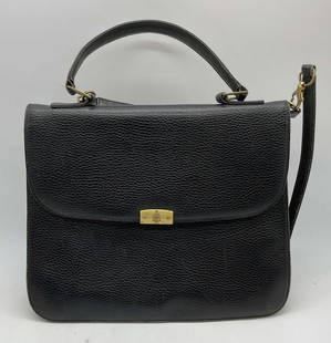 Vintage Mark Cross Black Leather Handbag: Vintage Mark Cross black leather handbag. Fold over flap, 2 interior compartment and 2 zippered pockets. Signed on hardware and interior. Measures approx. 11 x 3 x 8.5 inches. Wear including rubbing,