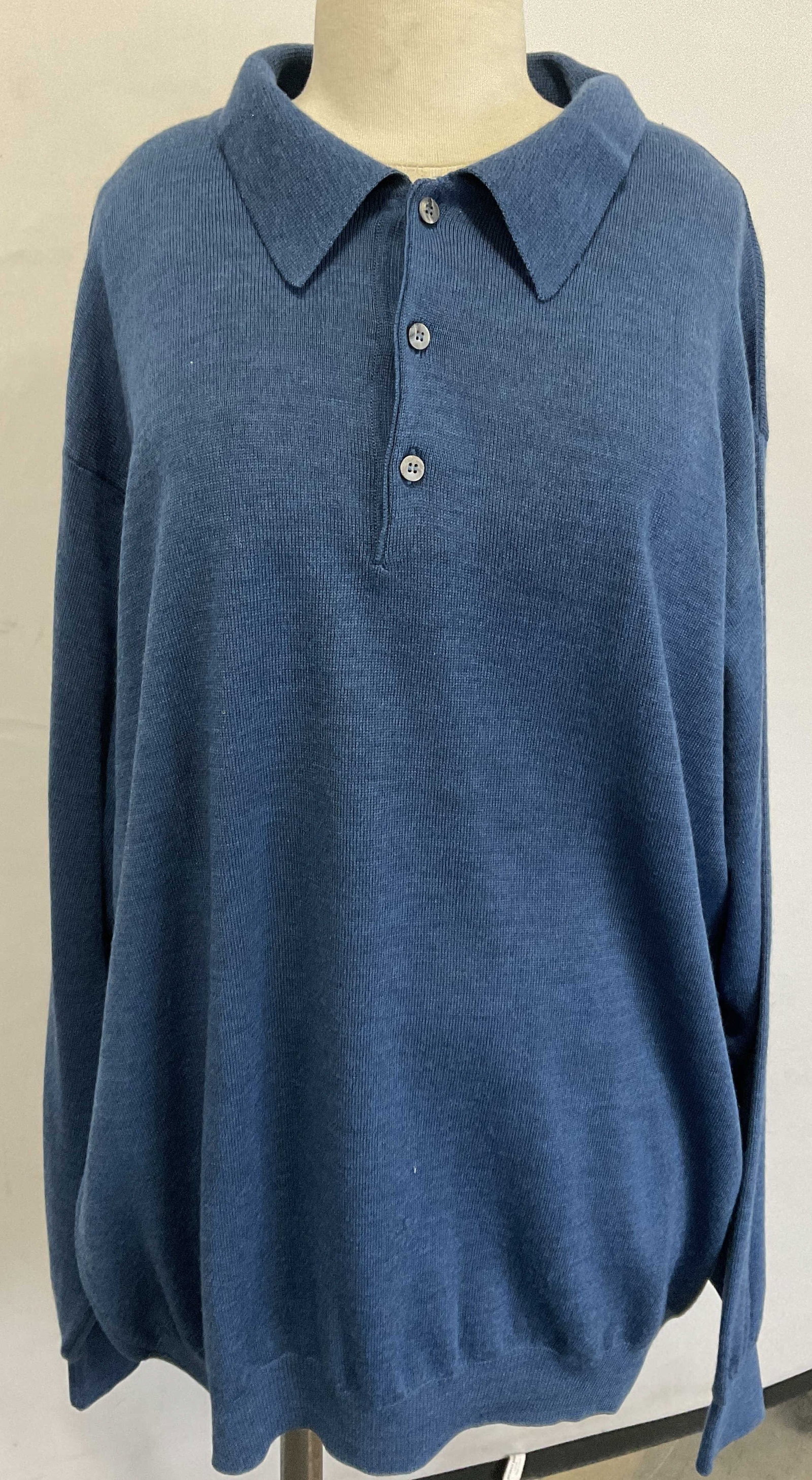 TOSCANO Blue 100% Merino Wool Sweater, Italy: TOSCANO Blue 100% Merino Wool Sweater. Deep blue hued button accent merino wool sweater. Tag reads TOSCANO, MADE IN ITALY, 100% Merino Wool, XLT. Length measured flat approx. 31 inches. Discoloration 