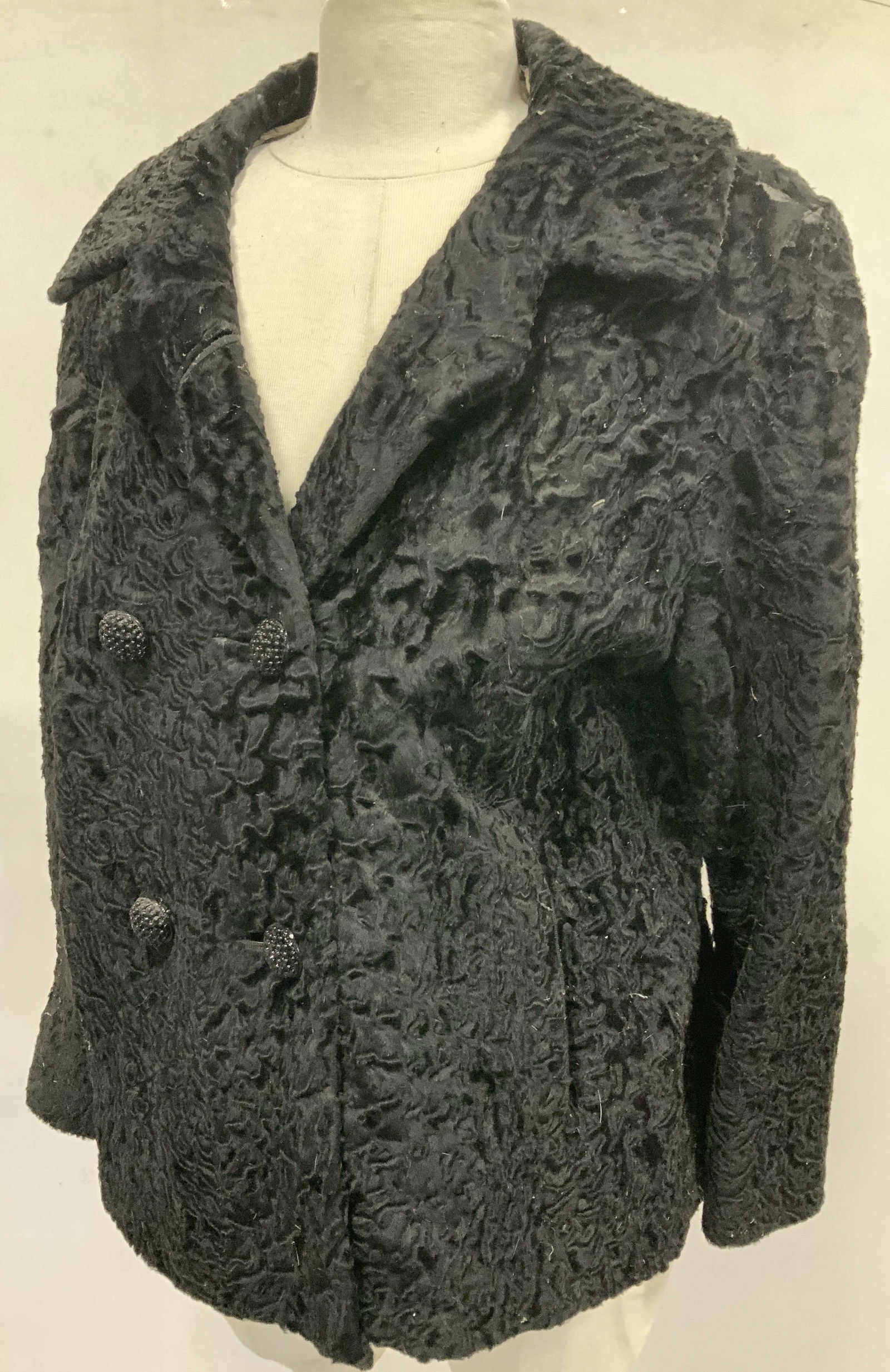 Emile Master Vintage Curley Lamb Jacket: Double breasted Vintage Emile Master of Stamford, CT Vintage Curley lamb cocktail jacket. 1960s. 6 black aurora borealis beaded buttons. 4 on front, 2 smaller on backside belt. Lining has wear- discol