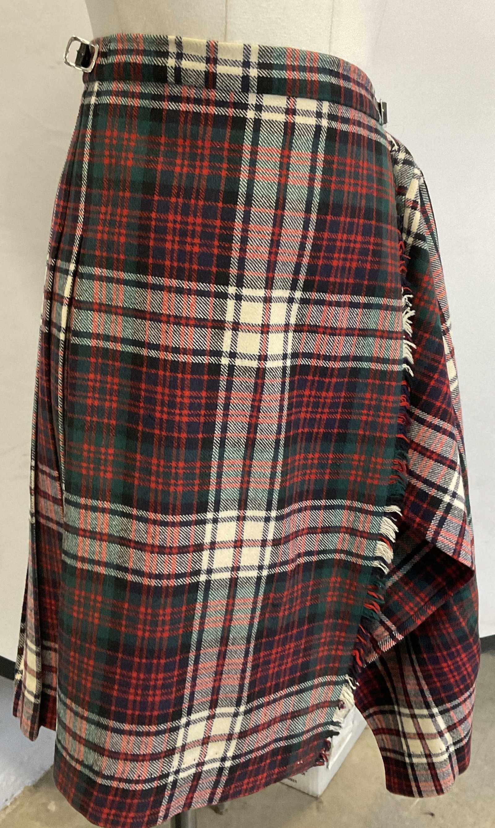 Vtg LAIRD PORTCH Pure New Wool Skirt / Kilt, Scot: Vintage LAIRD PORTCH Pure New Wool Skirt / Kilt. Primarily red, white, and green hues. Tags read LAIRD PORTCH OF SCOTLAND, PURE NEW WOOL. Belt hardware affixed to skirt. Hardware is worn. Wear to skir