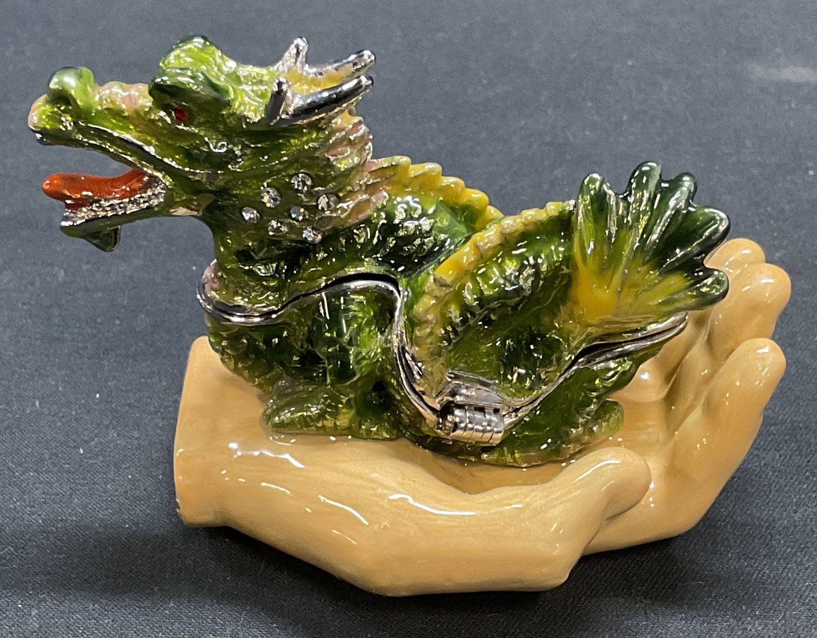Keren Kopal Enameled Dragon Hand Trinket Box: Keren Kopal enamel and crystal decorated dragon and hand motif trinket box. Signed on interior. Measures approx 2.75 x 1.75 x 2 inches. Includes box with fitted compartment. Some surface wear includin