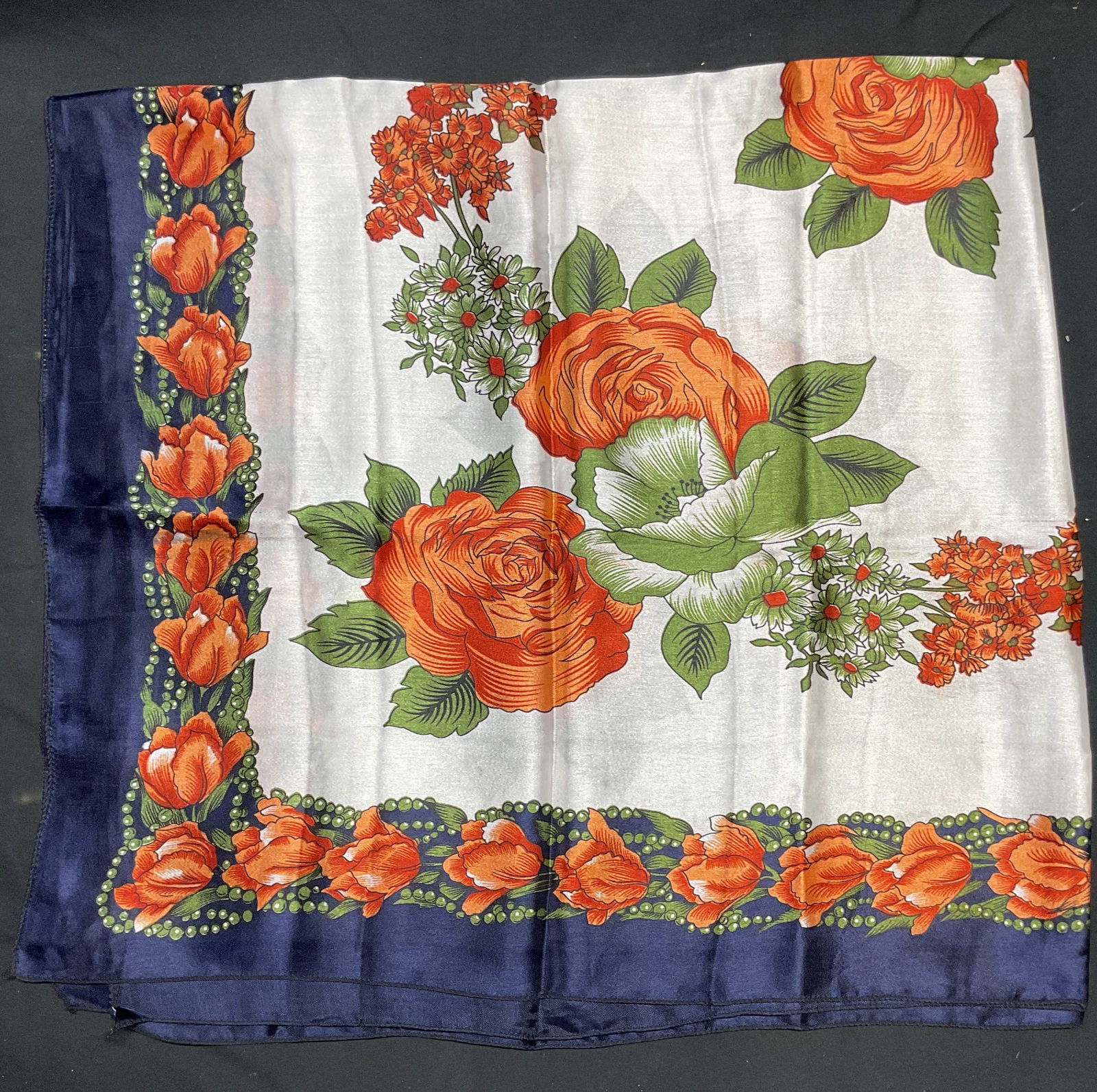 Blue & Red Floral Print Scarf: Blue, red, and green floral print scarf. Material feels like silk, possibly synthetic. Measures approx. 40 x 40 inches. Some wear to material including small holes and blemishes observed. Scarf, flora