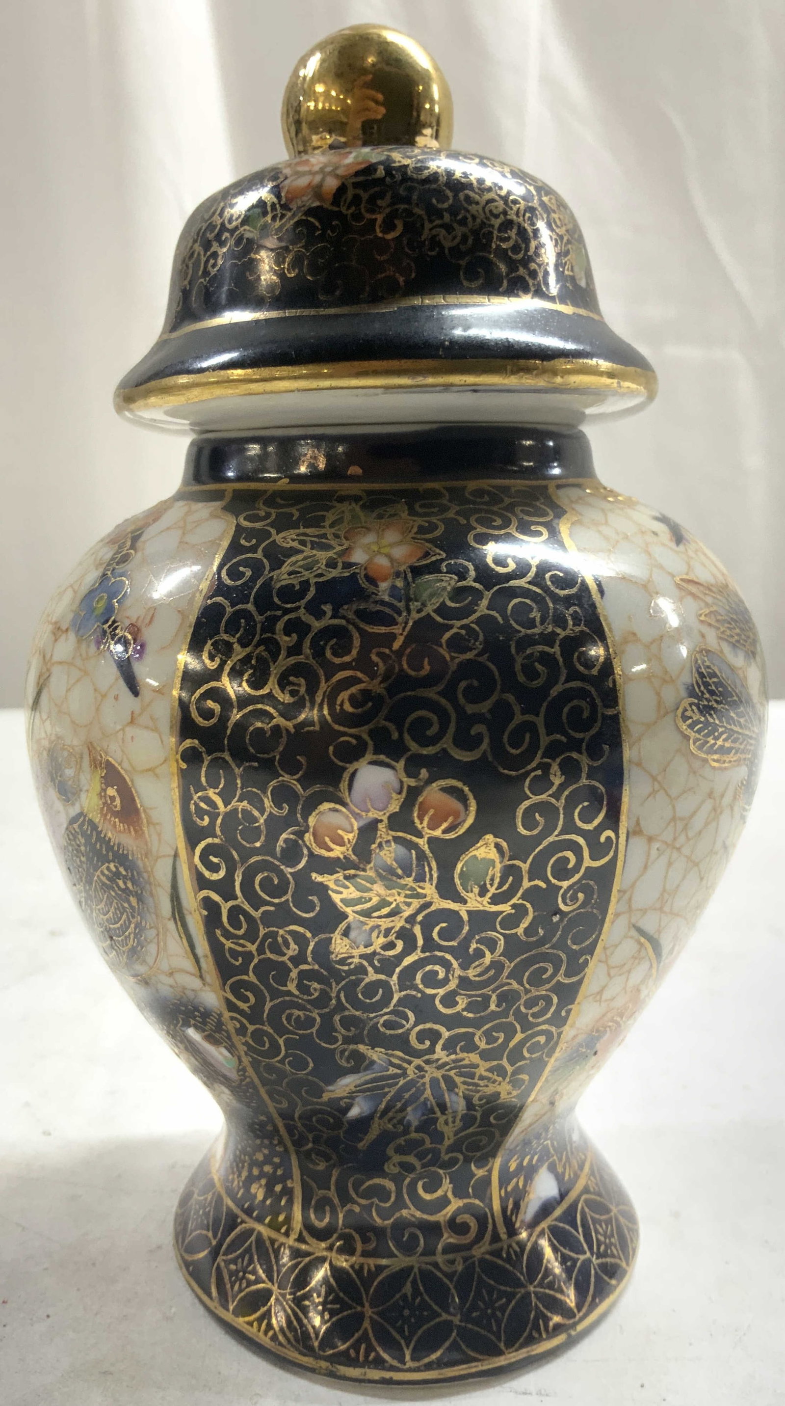 SATSUMA Hand Painted Asian Urn W Lid: Underside is marked SATSUMA HAND PAINTED. Urn is hand painted with floral, leaf, bird & gilt detail. Vessel includes lid. Urn measures approximately 6 inches tall 3.5 inches wide. Vessel, urn, ginger 