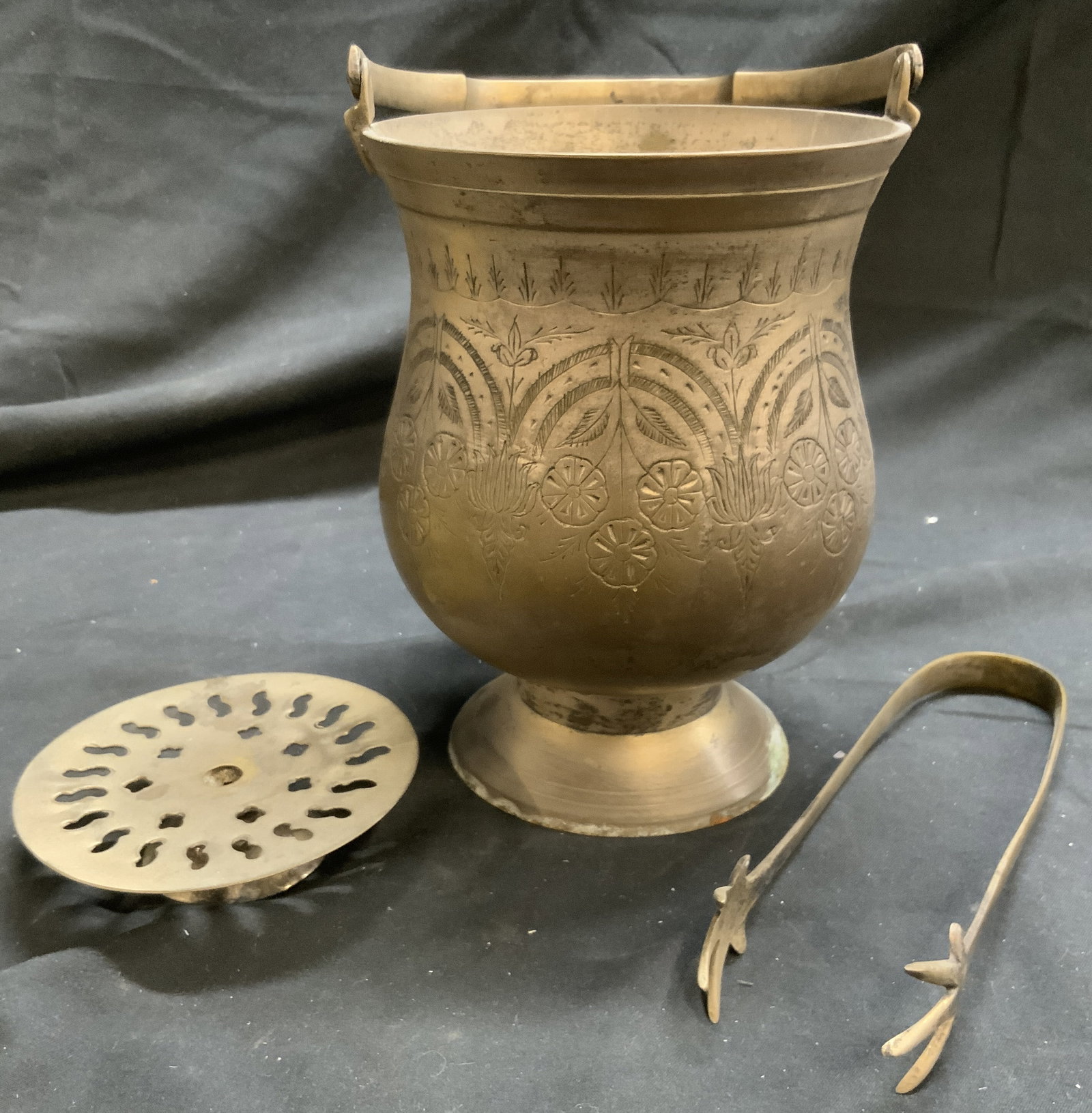 Lot 3 Vintage Brushes Metal Tbltop Accessories: Lot includes 1 pair of ice tongs, 1 footed ice bucket with intricate floral and leaf relief detail with handle, & 1 pedestal with pierced detail. Each piece is silver toned brushed metal. Ice bucket m