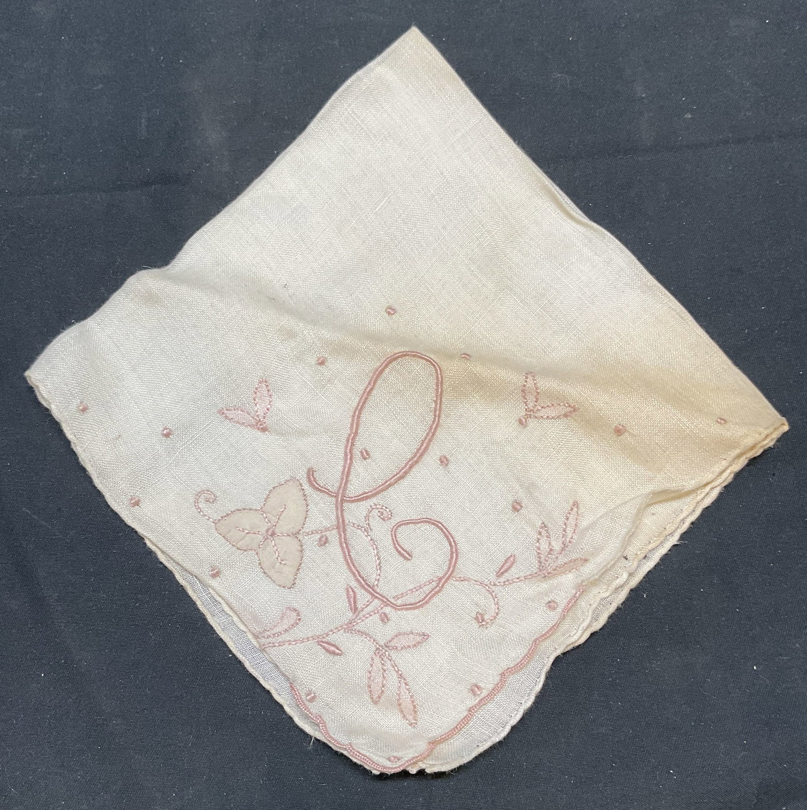 Vintage White Cotton Embroidered Handkerchief: Vintage white cotton handkerchief with embroidered monogram lower case e or upper case C. Measures approx. 11 x 11 inches. Wear to material including blemishes observed. Handkerchief, vintage handkerc