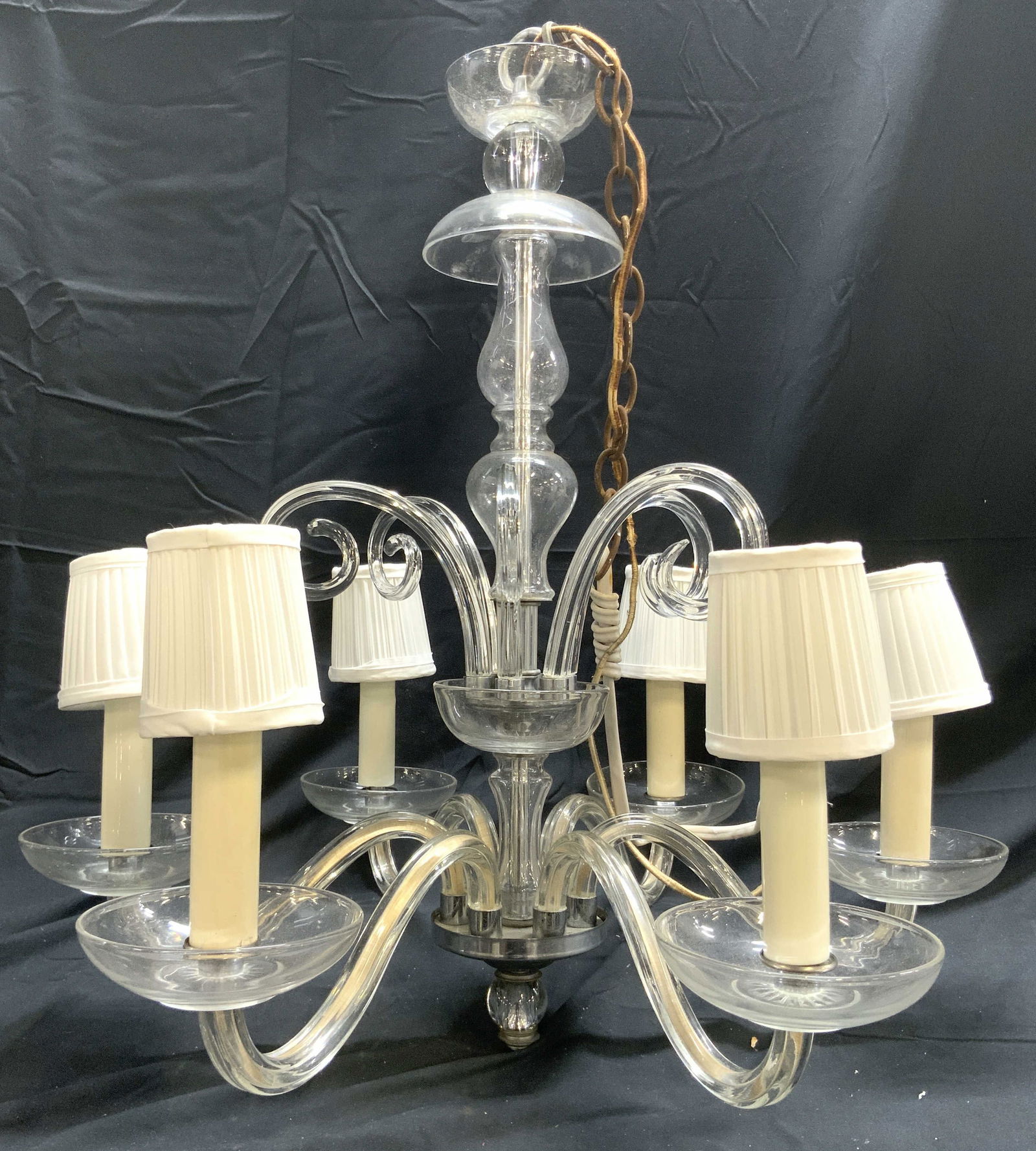 MURANO Art Glass 6 Arm Chandelier: Chandelier appears to possibly be Murano glass (no apparent tags or markings). Chandelier has 6 glass arms. Each with candlestick style bulb sockets at ends with white toned shades. Piece has art glas