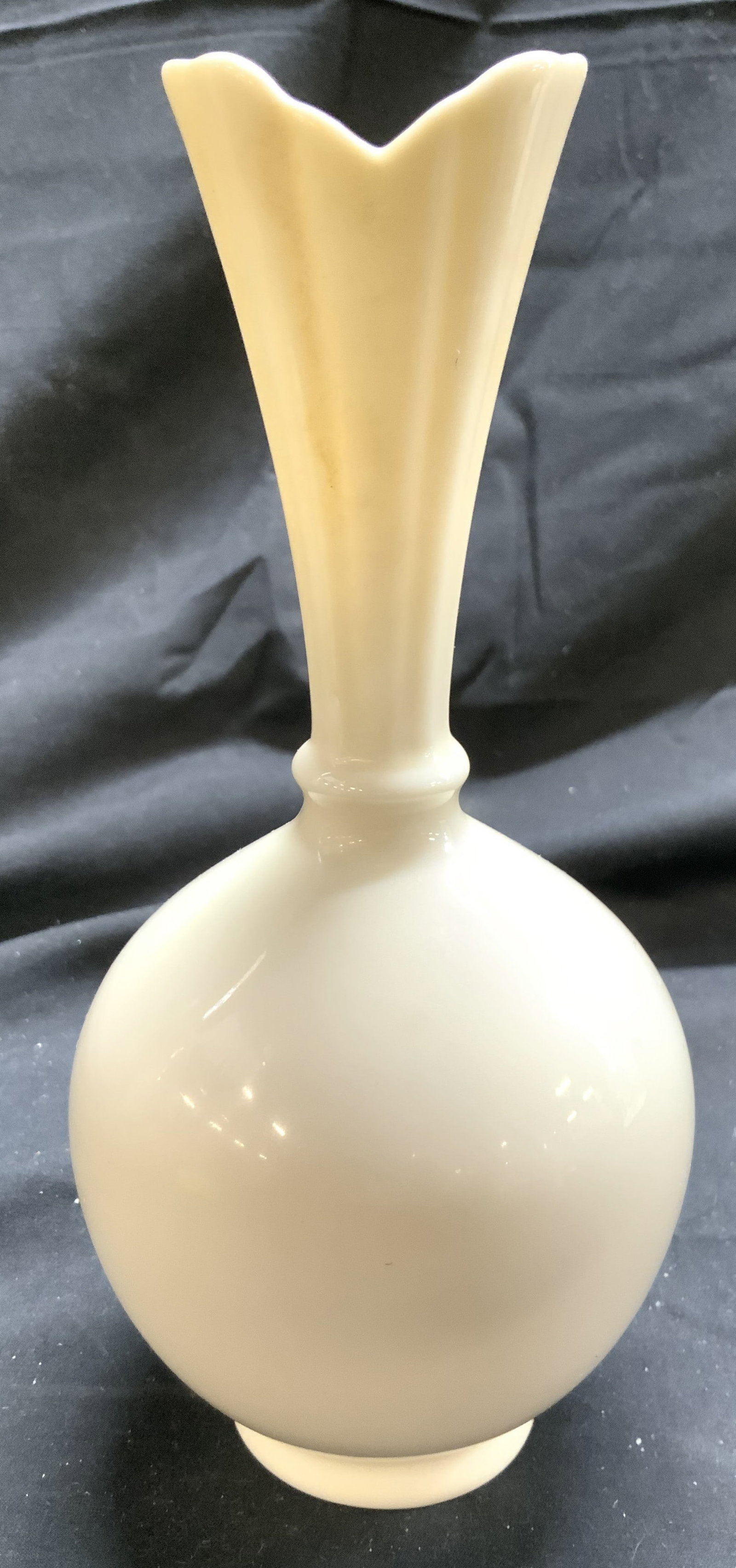 LENOX Porcelain Vase Vessel USA: Underside is marked LENOX MADE IN USA. Vase is cream toned and porcelain. Piece has narrow neck and rim. Piece has bulbous base & is footed. Vase measures approximately 8 inches tall 3.75 inches wide.