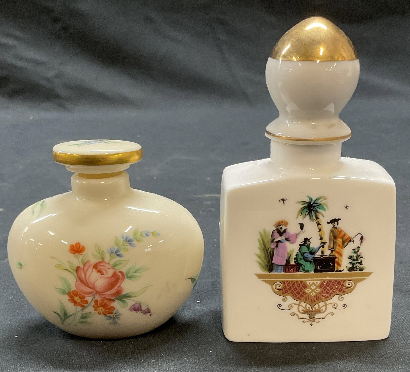Lot 2 Royal Worcester & Lenox Porcelain Bottles: Royal Worcester porcelain perfume bottle with Asian motif. Signed on underside. Made in England. Lenox porcelain perfume bottle with floral motif. Signed on underside. Made in USA. Larger piece measur
