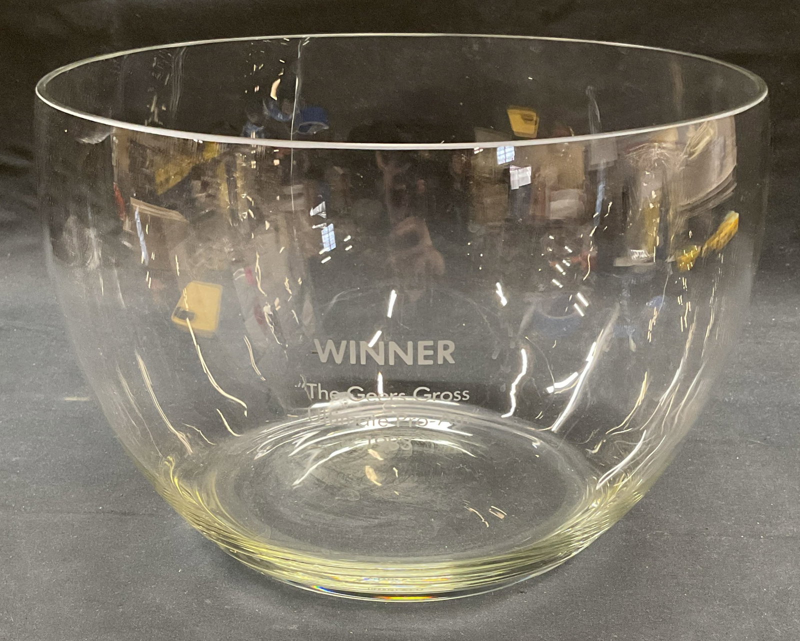 Vtg Tiffany & Co Glass Bowl, 9.5 Inches W: Vintage Tiffany and Co clear glass bowl. Signed near base. Engraved Winner ? 1983. Measures approx. 9.5 x 6.75 inches. Some surface wear including scratching observed. Tiffany and co, Tiffany and co b