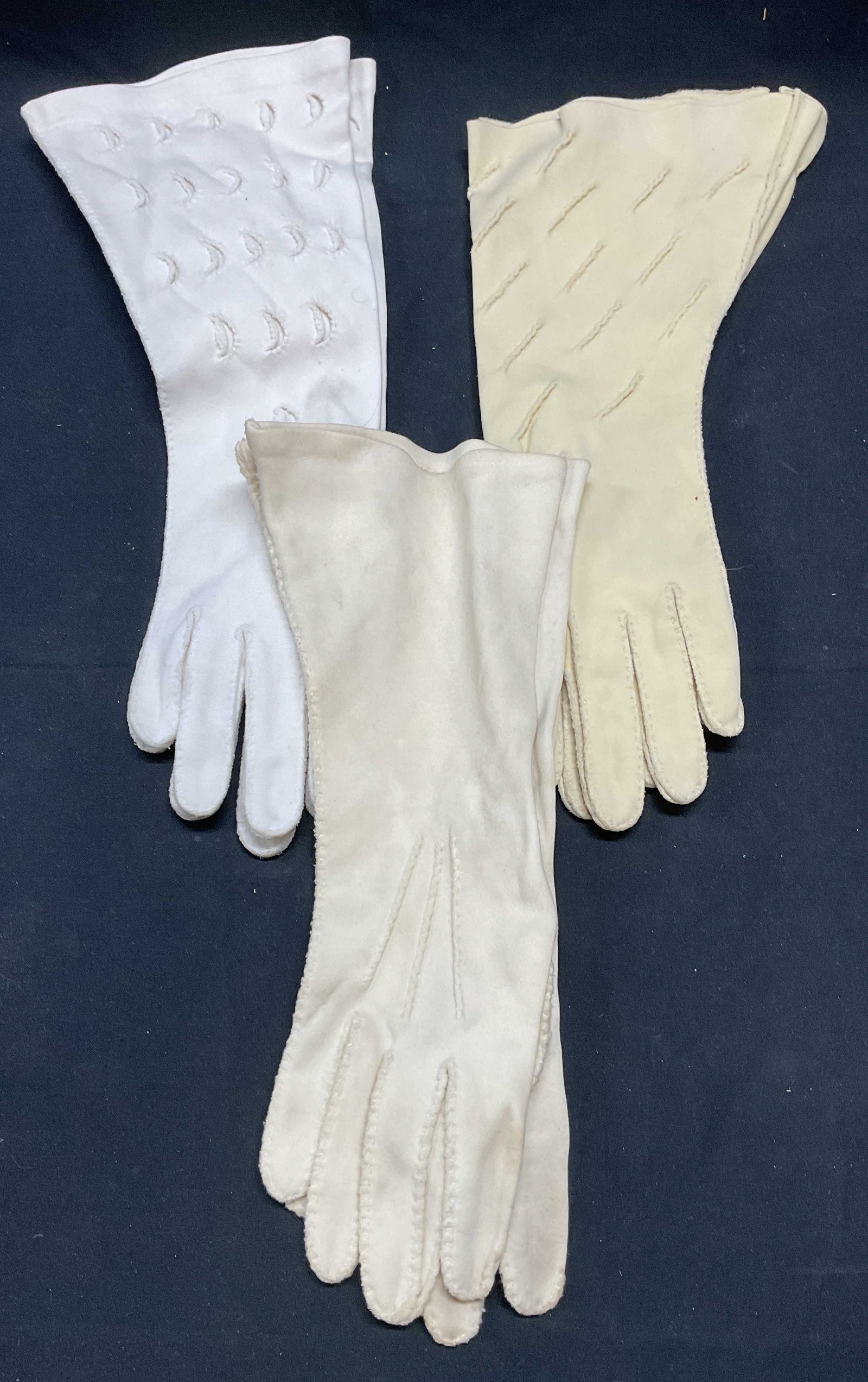 Lot 3 Elvette & Wear Right White Cotton Gloves: Lot of 3 pairs of vintage Elvette and Wear Right cotton gloves in white and beige. Longest pair measure approx. 13 inches long. All pieces have some wear to materials including blemishes observes. Glo