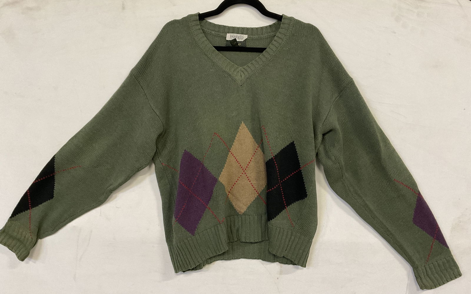 THE FAIRFIELD STORE AT EASE Argyle Sweater: THE FAIRFIELD STORE AT EASE Argyle Sweater. Purple, green, red, black, and beige hues throughout. Tags read THE FAIRFIELD STORE and AT EASE. Size tag reads Medium, 55% Linen, 45% Cotton. Measured flat