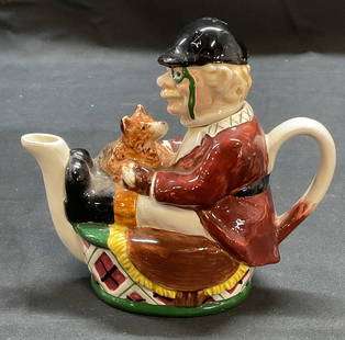 Vtg NORITAKE Porcelain Huntsman Teapot: Vintage NORITAKE porcelain Huntsman figural and dog motif teapot. Signed on underside. Measures approx. 5 x 2.5 x 4.75 inches. Some surface wear including scratching and small chips observed. NORITAKE