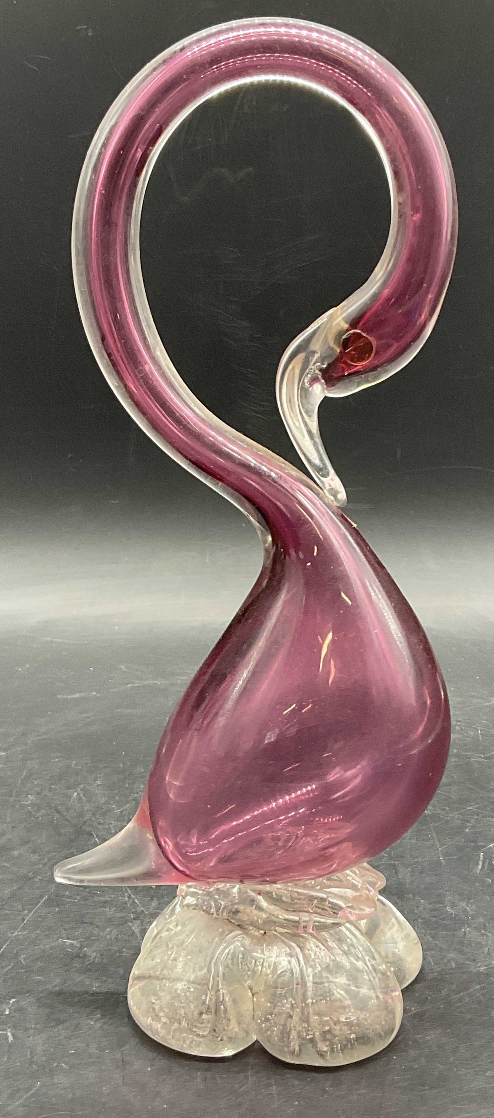 Pink & Clear Art Glass Curved Neck Bird Figural: Pink & Clear Art Glass Bird Figural. Curved neck to the piece. Measures approx. 10H x 4W in. Bubbles to the glass. Chipping, losses, and surface wear present. home decor, home accents, homewares, hous