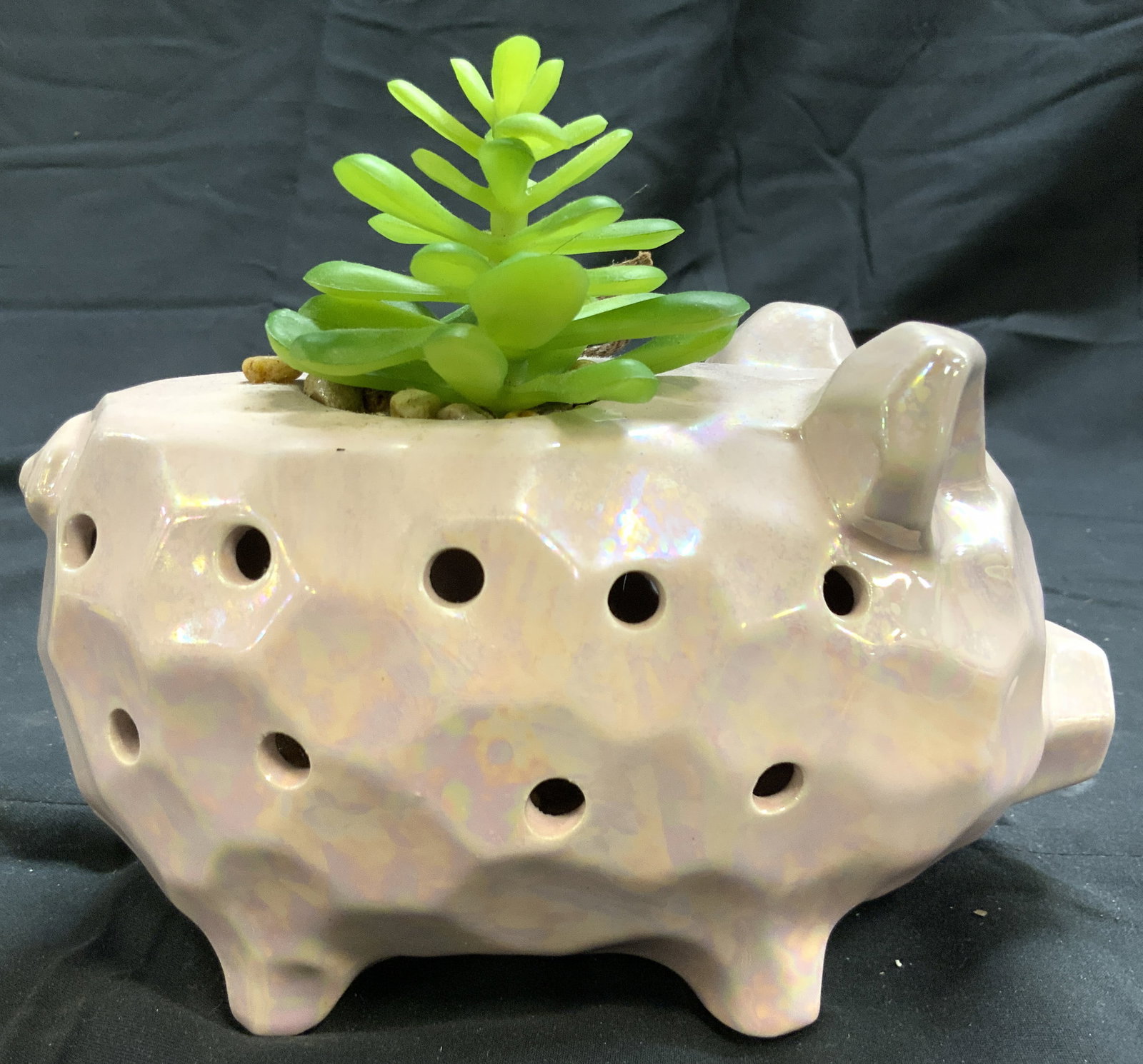 GC NATURALS Porc Pig Sachet W Iridescent Luster: Tag reads GC NATURALS. Sachet is pink toned and porcelain with iridescent luster. Piece has pig form. Piece has holes in each side. Sachet is footed. Piece measures approximately 7.5 inches deep 4.5 i