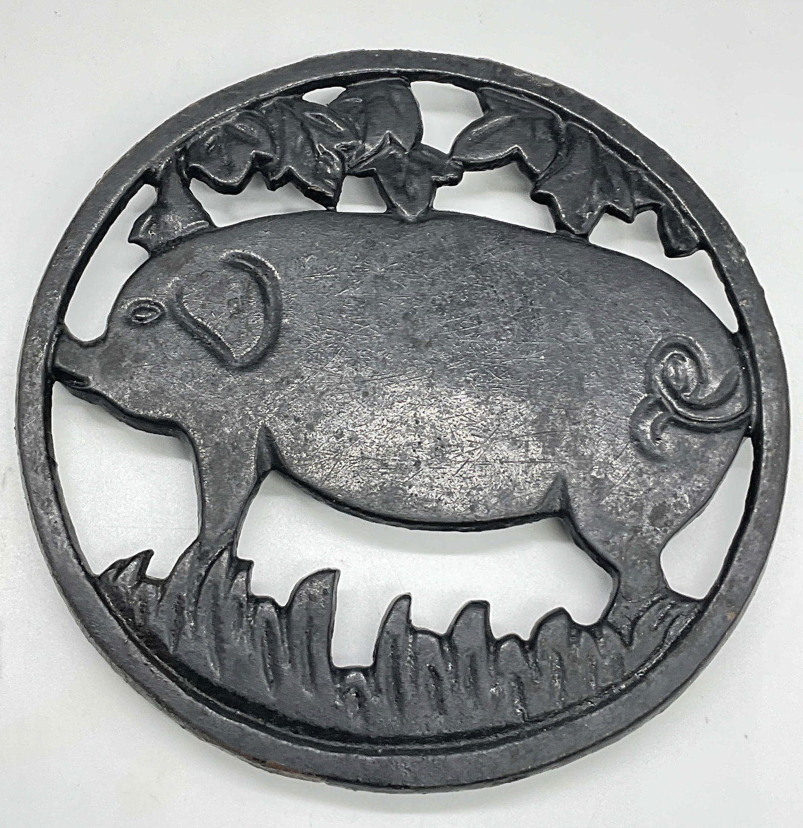 Vintage Black Iron Pig Motif Trivet: Vintage Black Iron Pig Motif Trivet. Measures approx. 5.5W x .5H in. Rusting, discoloration, and surface wear present. home decor, home accents, homewares, housewares, home accessories, collectibles,