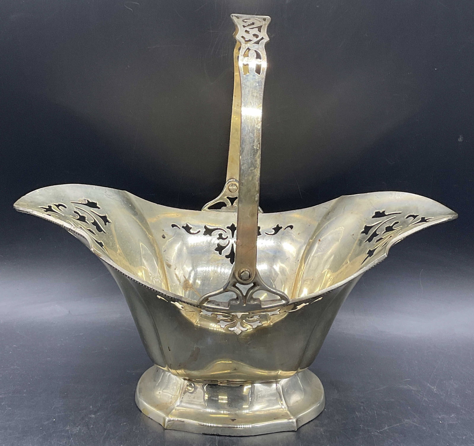 LBS CO. Vintage Metal Handled Basket: LBS CO. Vintage Metal Handled Basket. Pierced metal detail. Underside marked LBS CO. 1567. Measures approx. 5.5H x 11.5W in. Surface wear, losses to finish, and residue present. home decor, home accen