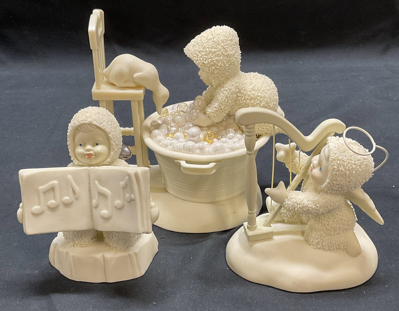 Lot 3 Department 59 Snowbabies Porc Figurals: Lot of 3 vintage Department 59 Snowbabies porcelain and composite Figurals. All pieces signed on underside. Largest approx. 5 x 4 x 5 inches. All pieces have surface wear including scratching and some