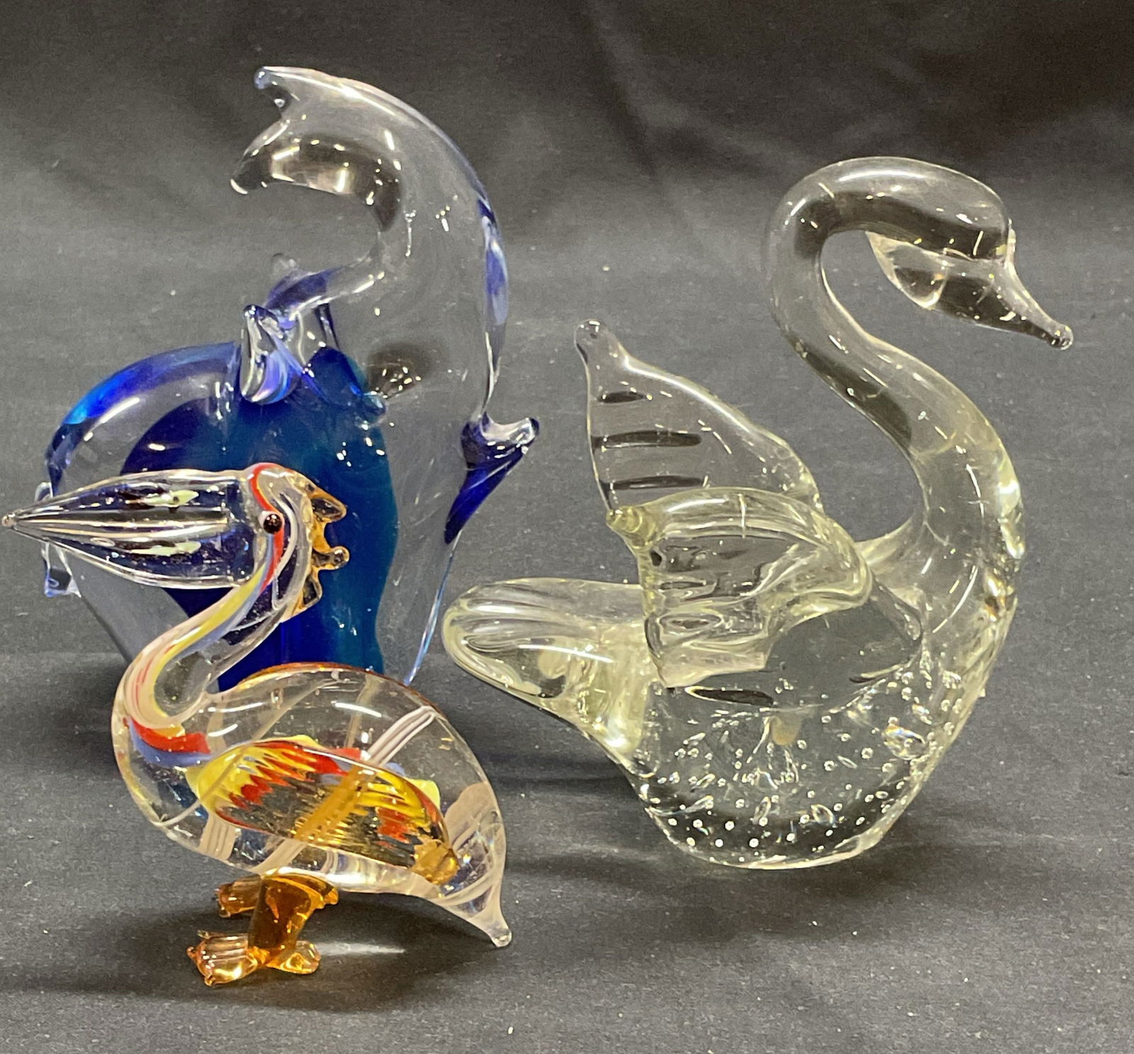 Fitz & Floyd Art Glass Pelican Figural +: Fitz and Floyd art glass pelican figural. Signed on underside. Art glass swan and art glass elephant figurals. Sizes vary. Largest approx. 4 inches tall. All pieces have wear including scratching obse