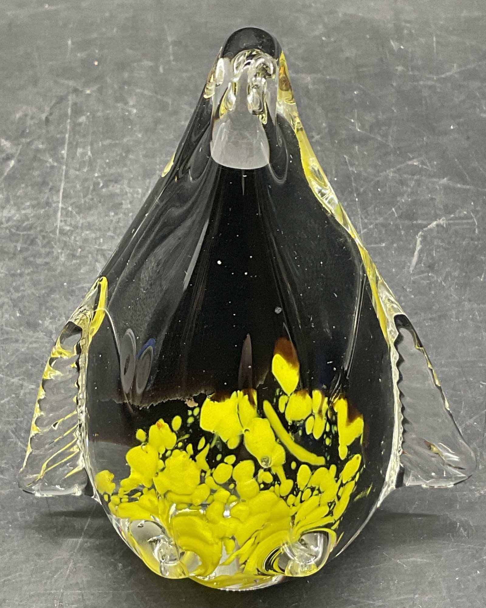 Art Glass Penguin Figural: Art Glass Penguin Figural. Yellow swirls to the base. Measures approx. 4H x 3.25W in. Bubbles to glass. Writing to underside and surface wear present. home decor, home accents, homewares, housewares, 
