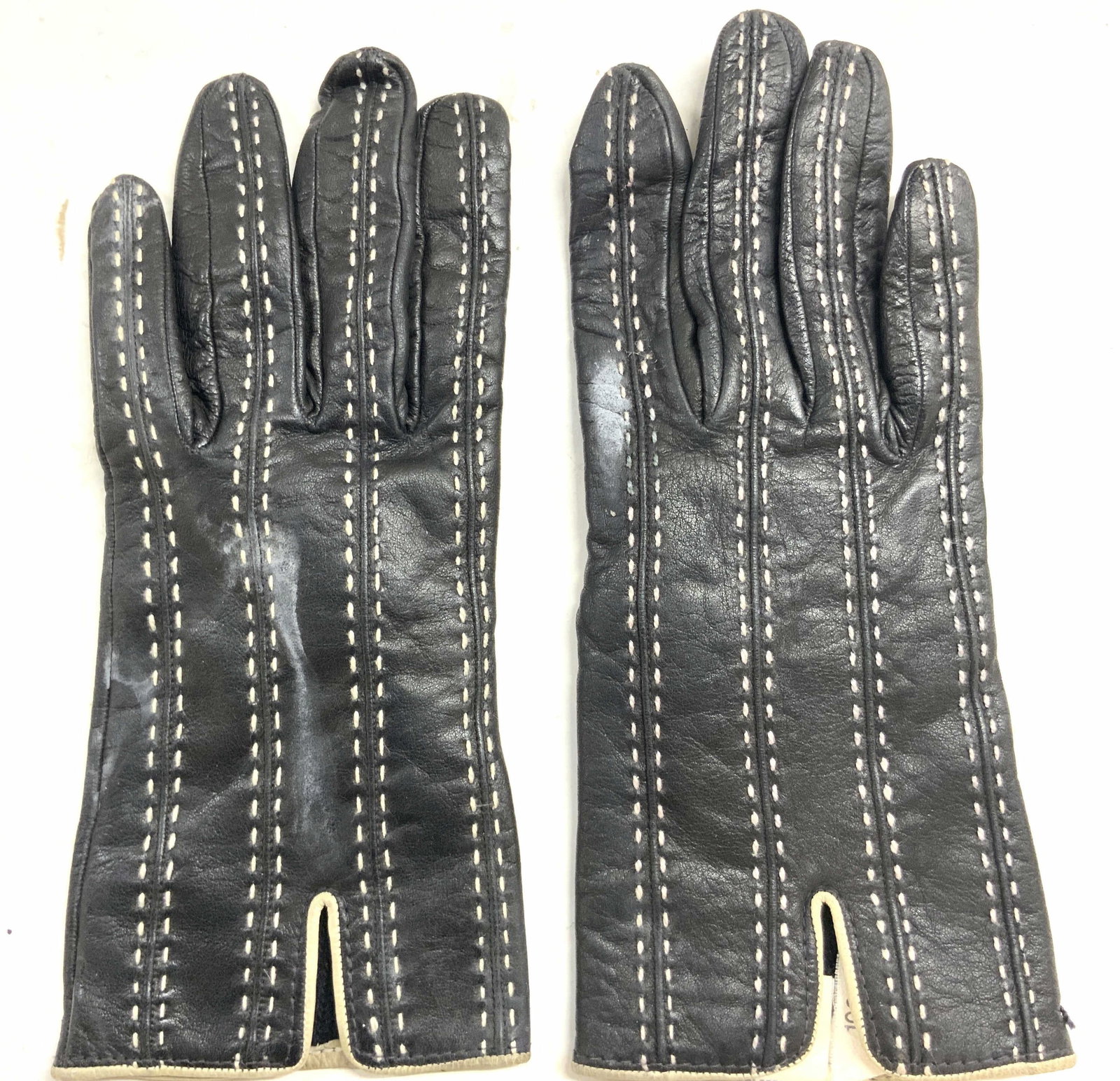 GILMAR Pr Leather & Wool Gloves ITALY: Tag reads GILMAR ITALY. Lot includes a pair of gloves. Each are black toned with white stitch detail. Gloves have leather exteriors & wool interiors. Gloves each measure approximately 8.75 inches tall