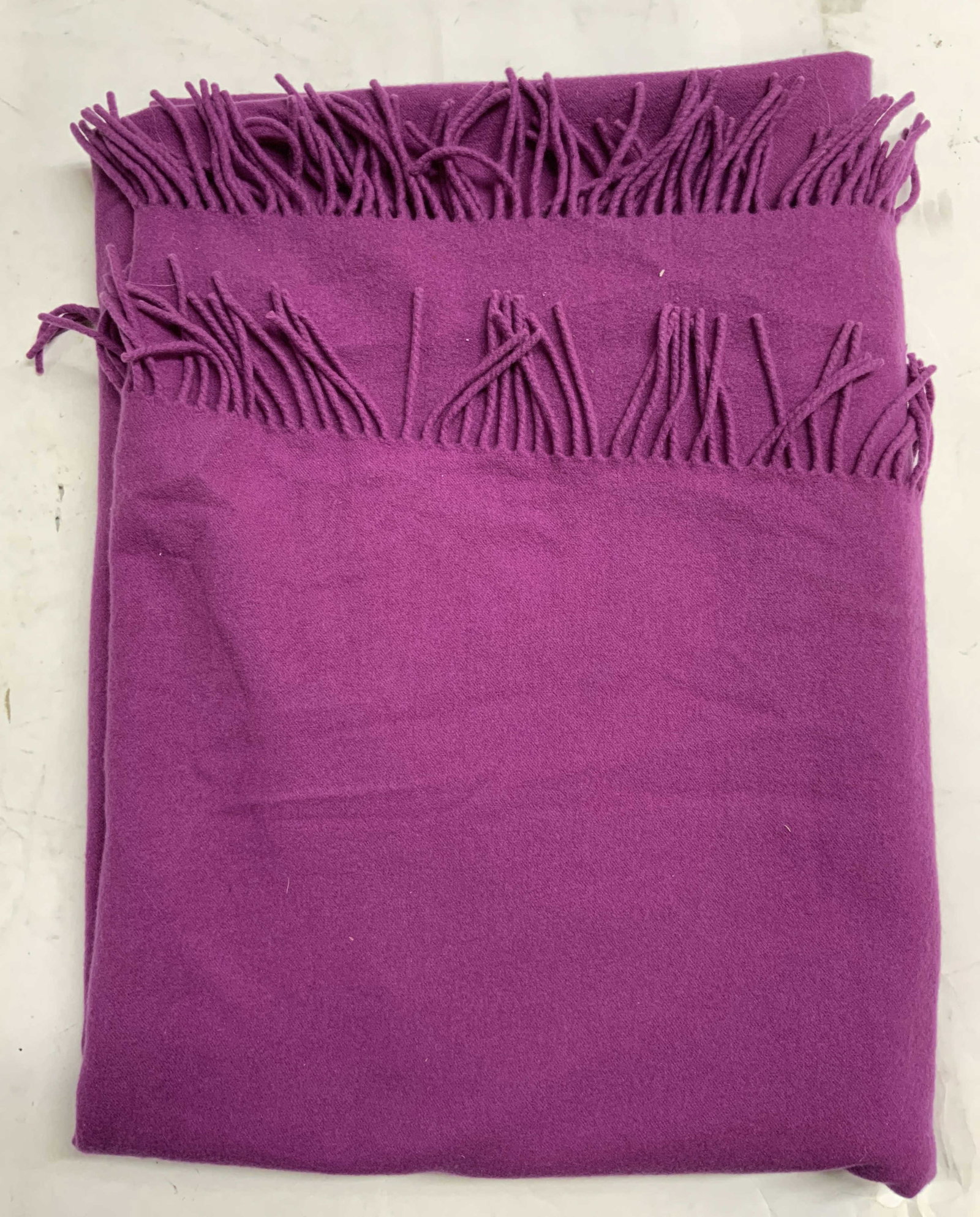 BANANA REPUBLIC Purple Polyester Fringed Shawl: Tag reads BANANA REPUBLIC. Shawl is purple toned. Piece appears to be polyester. Shawl has fringes at edges. Shawl measures approximately 68 inches long with fringes 54 inches wide. Shawl, Banana Repu
