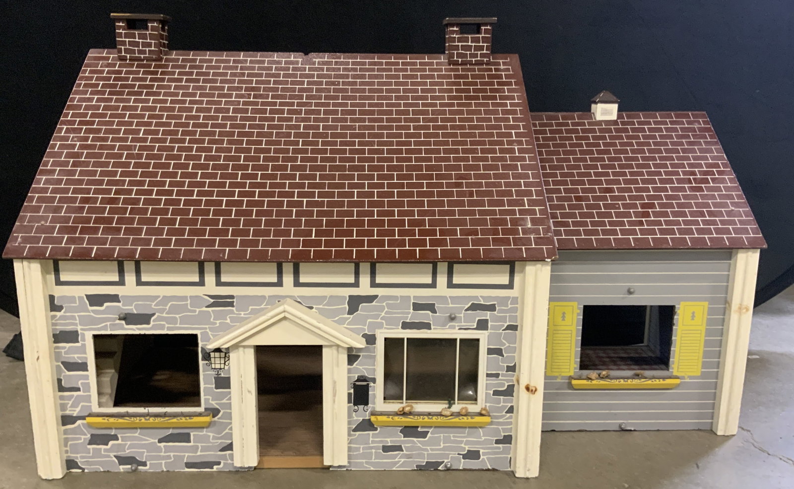 Vintage Wooden Four Room Dollhouse: A vintage multicolored dollhouse primarily crafted from wood. Four rooms to the piece. Measures approx. 38W x 23H in. Chipping, losses, and surface wear present. Collectibles, tabletop accessories and