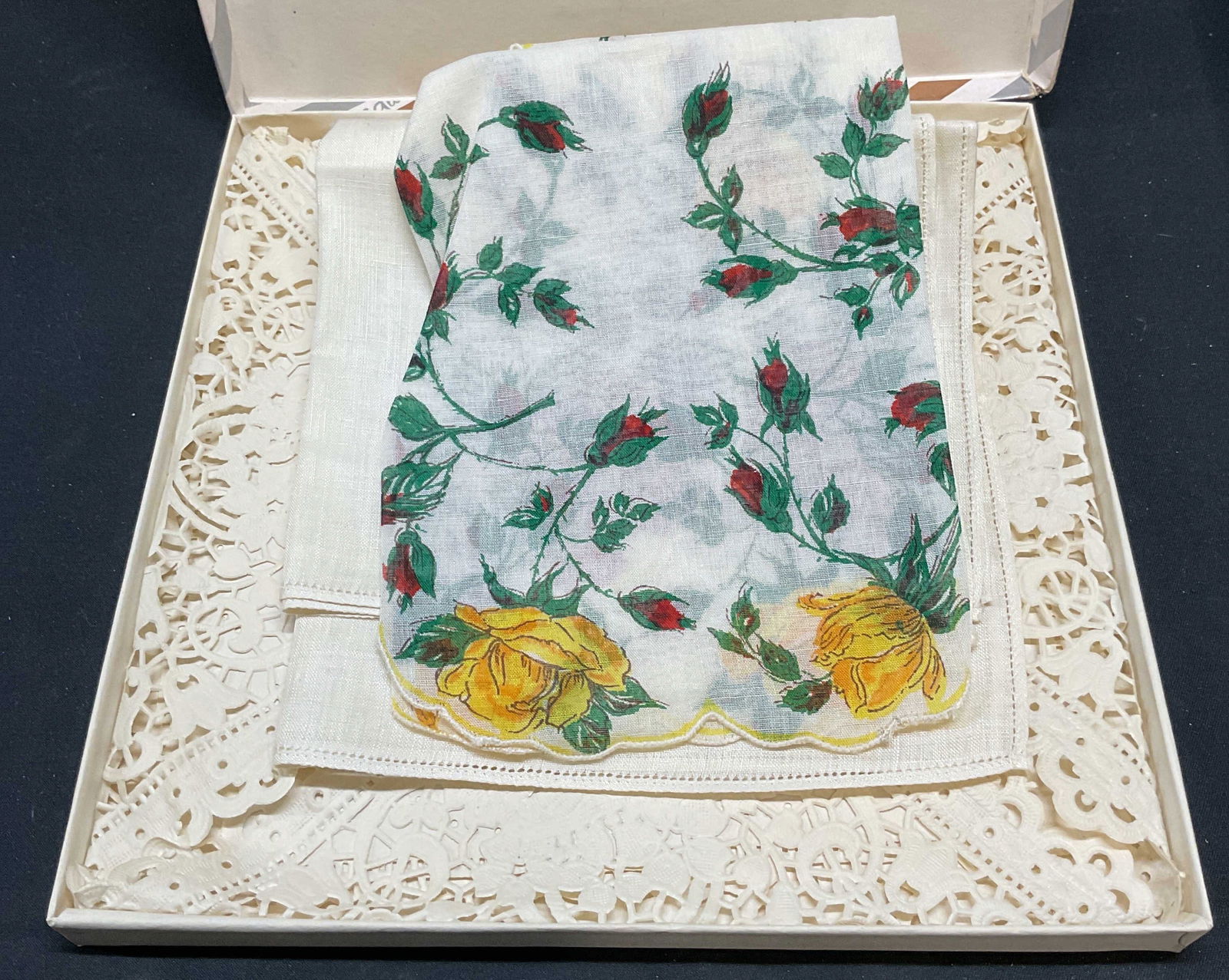 Lot 3 Linen, Cotton Doilies, Handkerchief: Vintage white paper lace doily, floral print cotton doily, and linen handkerchief. Largest measures approx. 16.5 inches wide. Includes box. All pieces have some wear consistent with exposure. Doily, p