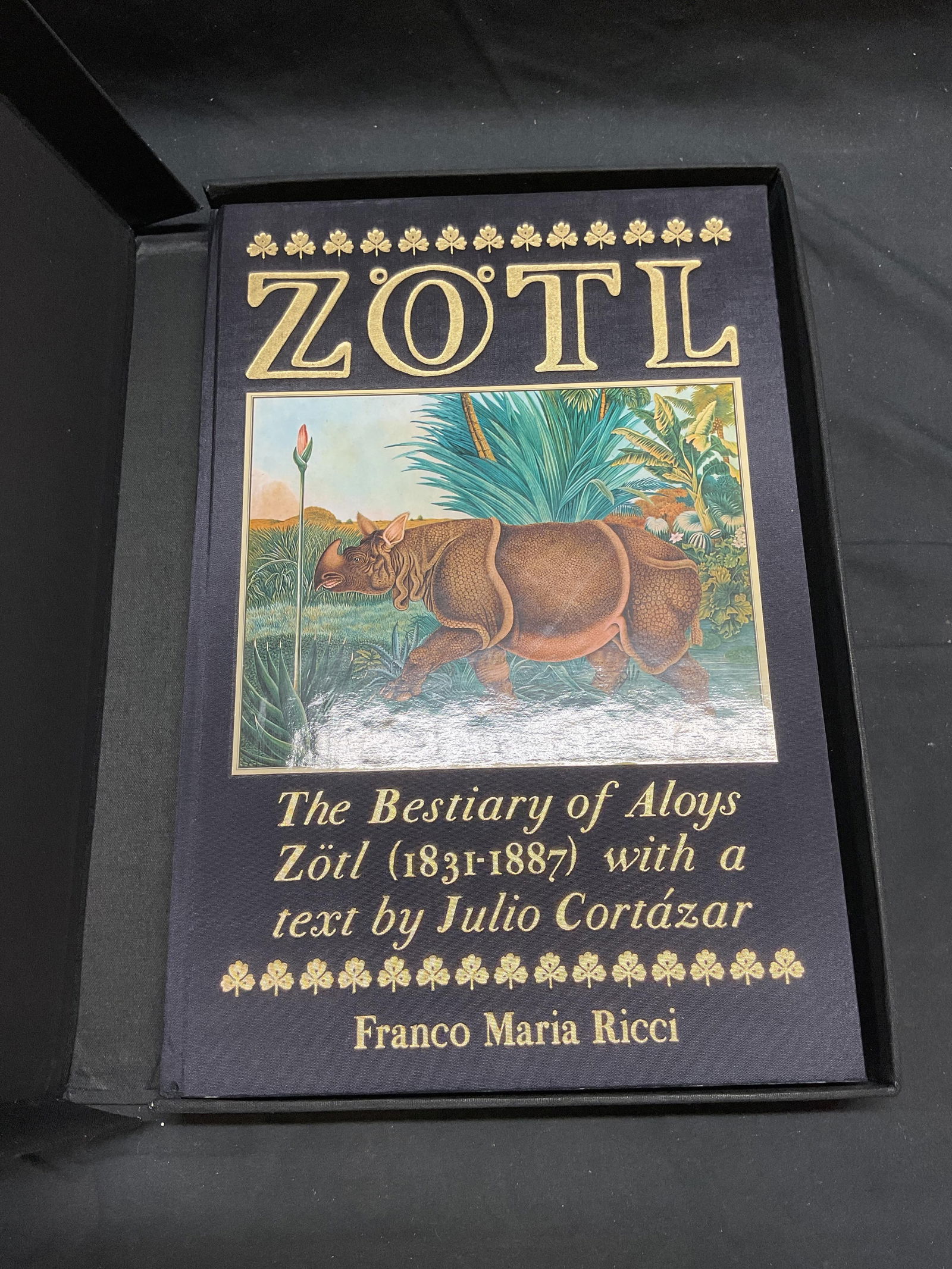 The Bestiary of Aloys Zotl, 1992, Illustr: Hardcover copy of The Bestiary of Aloys Zotl. Text by Julio Cortozar. Published by Franco Maria Ricci, 1992. Contains full color pasted in illustration. Includes fabric covered decorative protective b