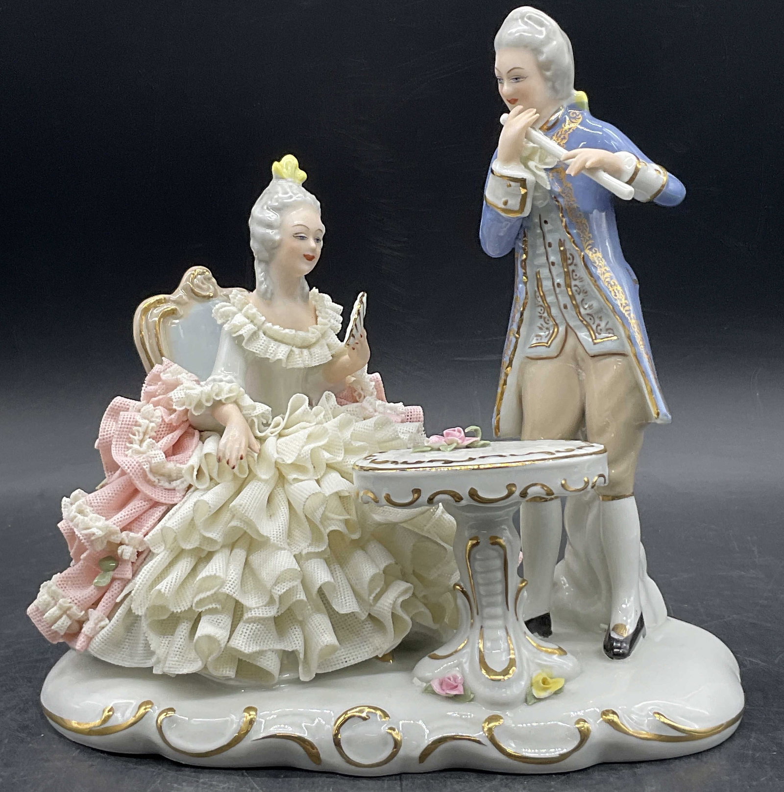 DRESDEN Lace Porcelain Hand Painted Couple Figural: DRESDEN Lace Porcelain Hand Painted Couple Figural. Measures approx. 8H x 7W in. Underside is signed and trademarked, verbiage appears to read DRESDEN. Chipping and surface wear present. home decor, h