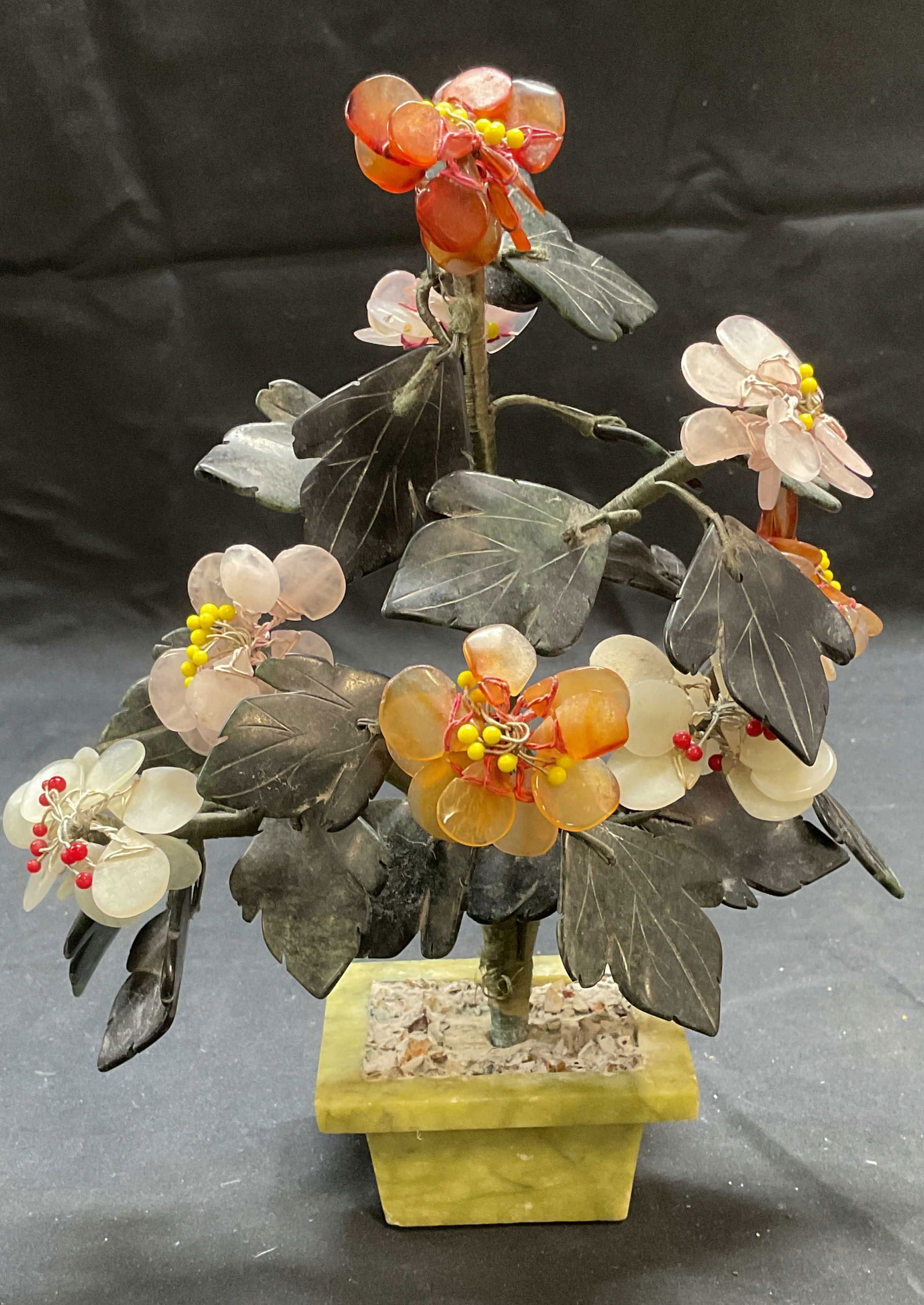 Carved Jade & Semiprecious Stone Flower Figural: Carved jade and semiprecious stone flower figural. Measures approx. 9 inches tall. Some wear to materials consistent with exposure. Jade flower, flower figural, stone flower, collectibles, decorative