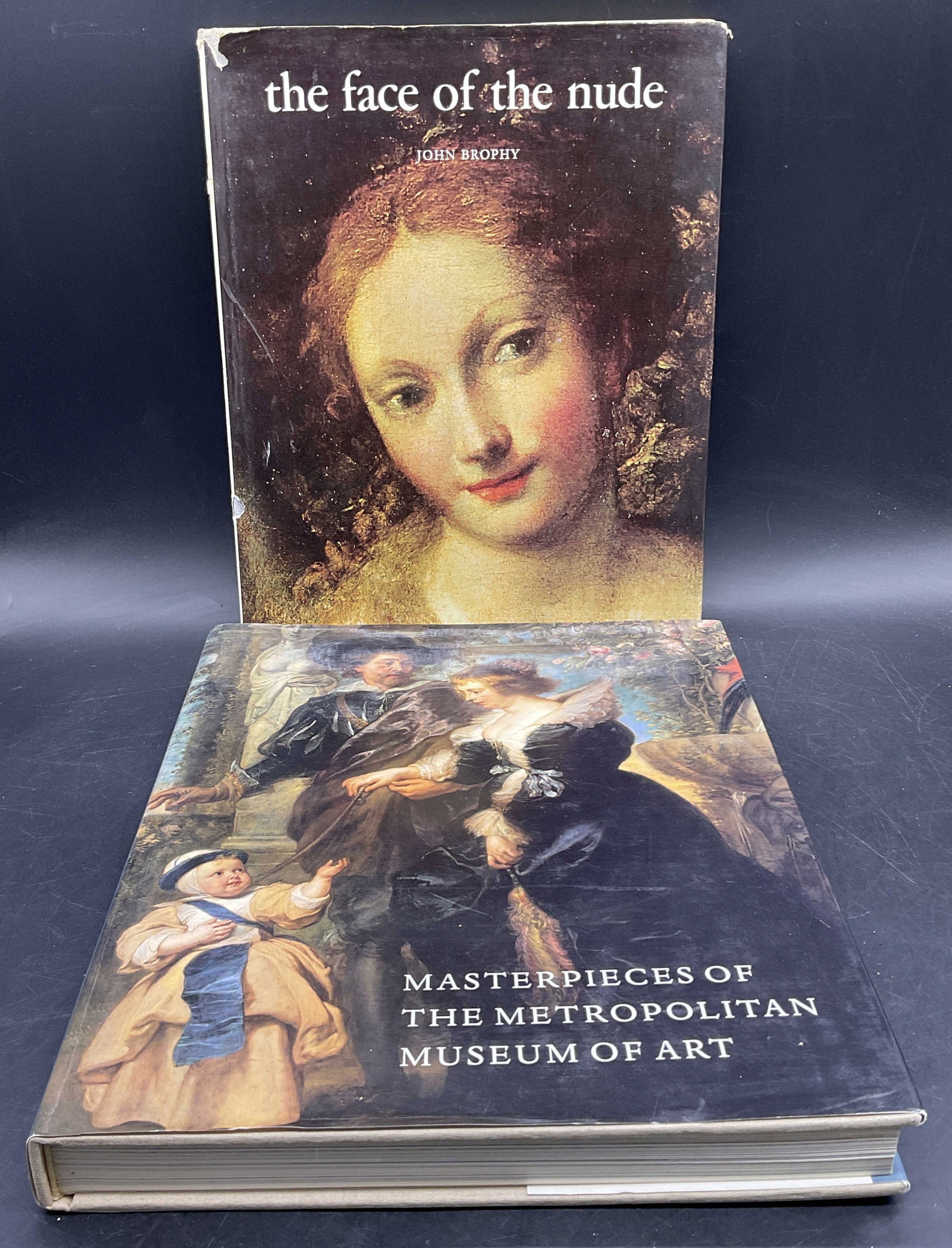 Lot 2 Hardcover Illustrated Art Books, 1993+: Two hardcover illustrated art books. Titles include: - 1993 MASTERPIECES OF THE METROPOLITAN MUSEUM OF ART, Introduction by Philippe de Montebello. Measures approx. 12.25H x 9.75W in. -The Face of the
