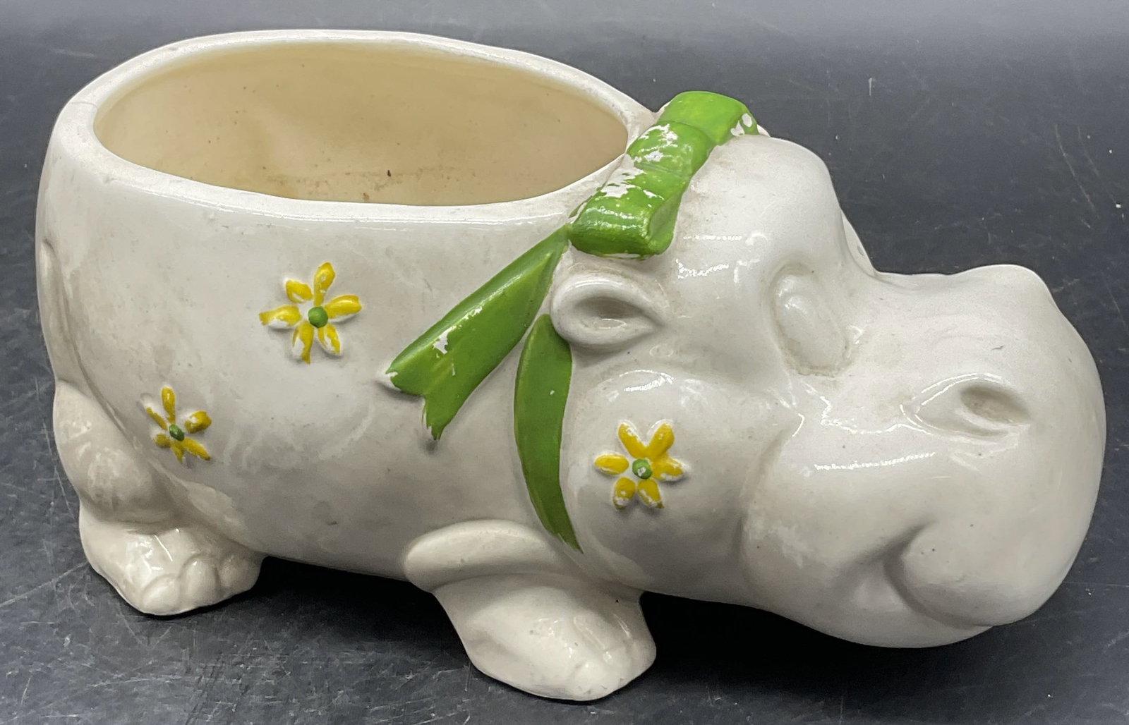 Vintage Ceramic Hippopotamus Vessel, Japan: Vintage Ceramic Hippopotamus Vessel. Floral motif to the sides. Underside marked JAPAN. Cracking, residue, losses to paint and surface wear present. Measures approx. 3.25H x 7W in. home decor, home ac