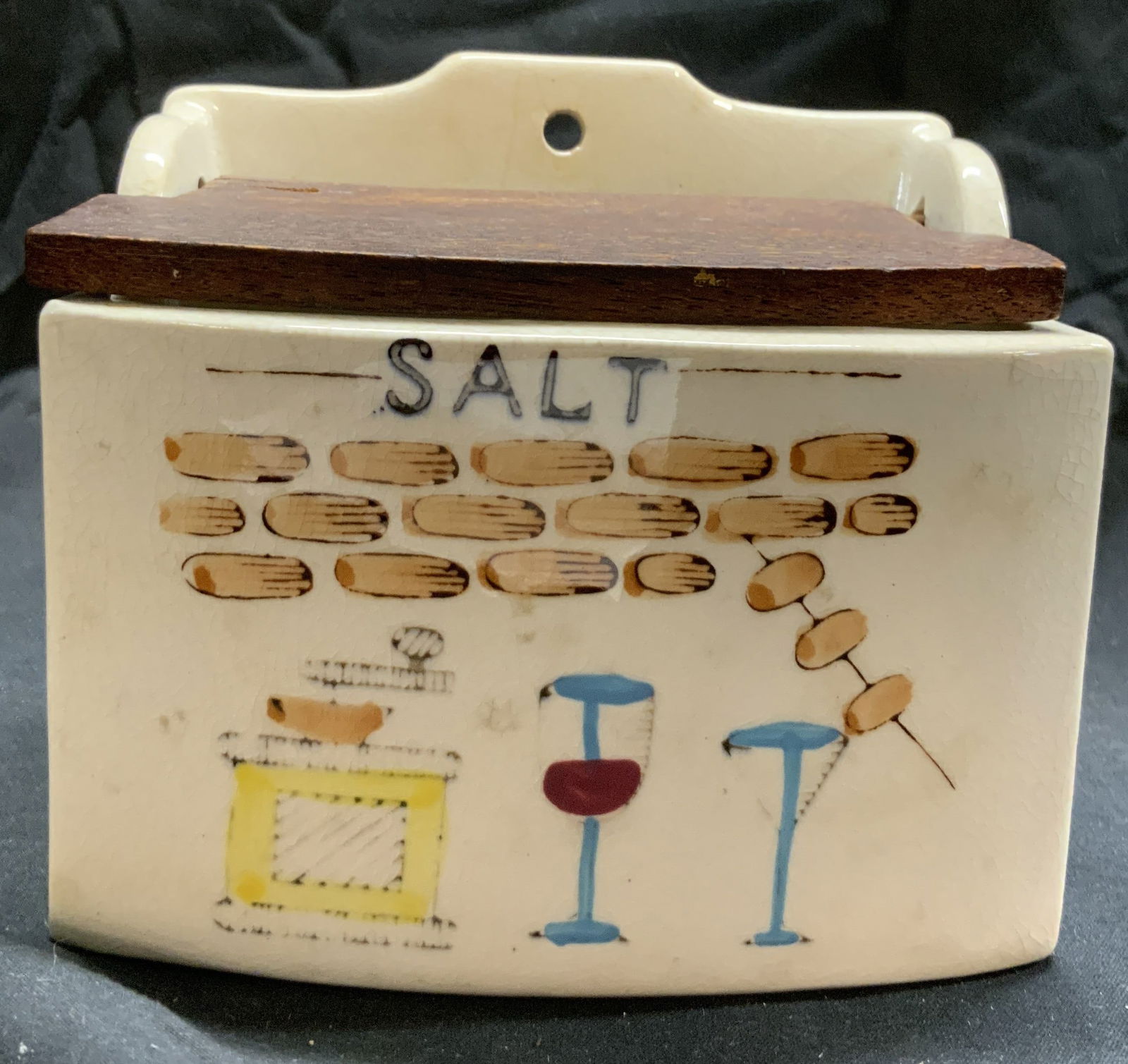 KITCHEN KING Vntg Porc Wall Salt Container W Lid: Tag on underside reads KITCHEN KING JAPAN. Container is vintage and porcelain. Piece has brown toned wooden lid. Container has brick, stove, & cocktail detail, possibly hand painted. Top of piece has