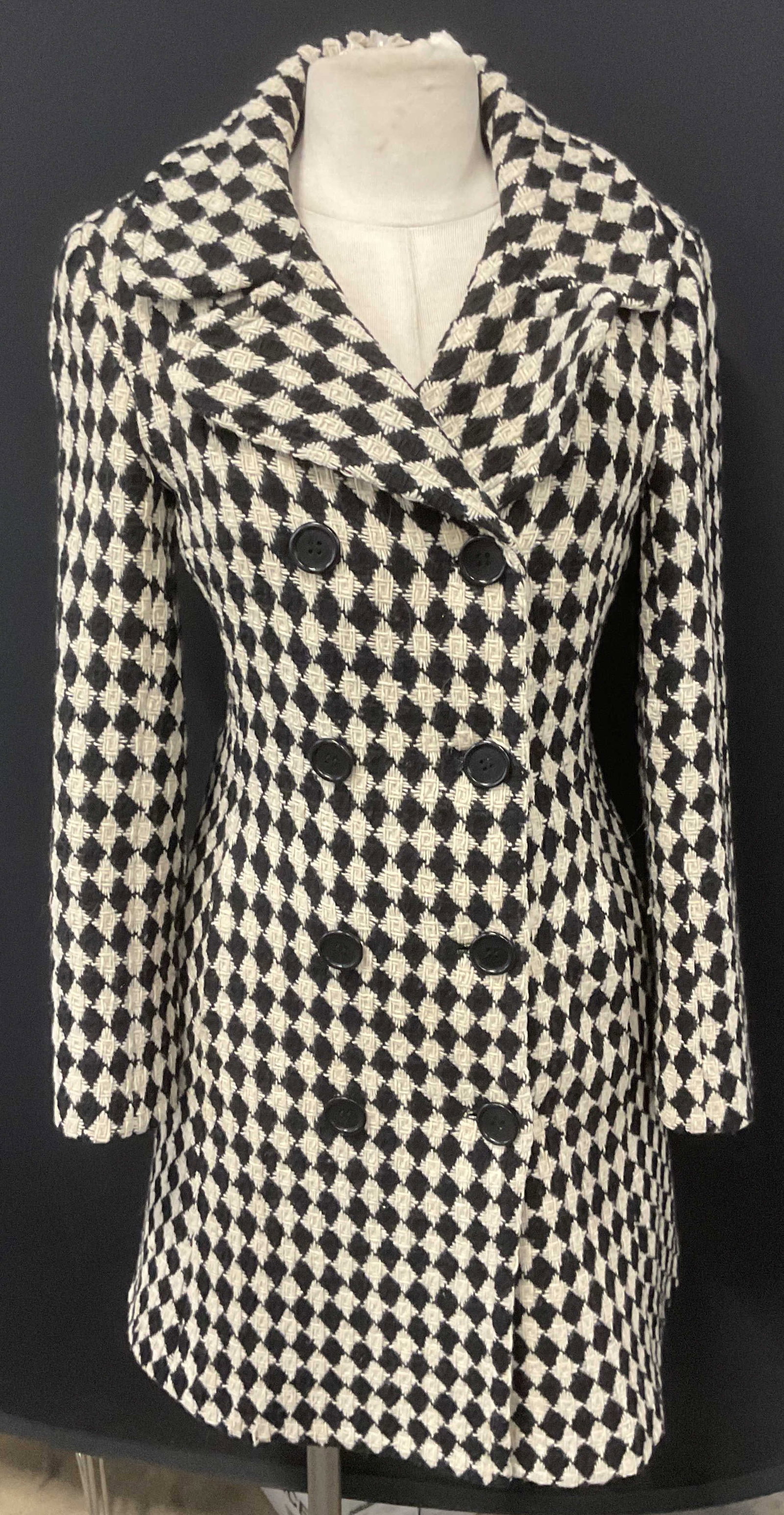 Set 2 Trina Turk Black & White Wool Coat & Skirt: Set of Trina Turk coat and skirt. Knit diamond pattern in black and white. Coat size 6 and skirt size 4. Skirt has front zipper and coat has front buttons. Coat and skirt 80% Virgin wool 20% nylon. Bo