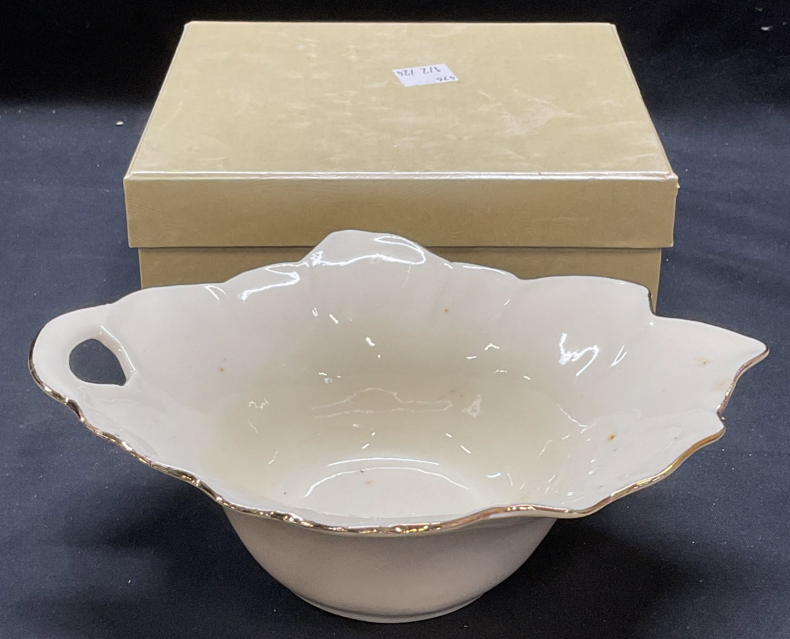 JS Imports Fine Porcelain Leaf Bowl: JS Imports fine porcelain leaf motif bowl with handle. Includes box with fitted compartment. Trademarked on underside. Bowl measures approx. 7 x 5.75 x 2.5 inches. Some wear including scratching obser