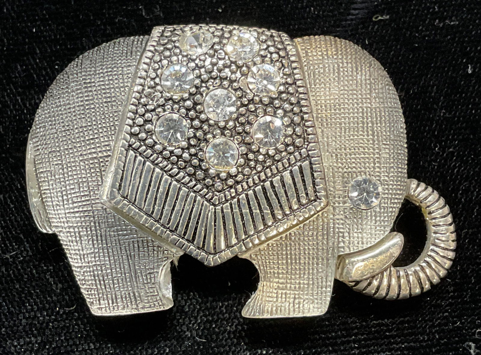 Silver Tn Crystal Lucite Elephant Brooch: Silver tone crystal and lucite decorated elephant motif brooch. Hinge pin on underside. Measures approx. 1.25 x 2 inches. Some wear including scratching observed. Jewelry, estate jewelry, costume jewe