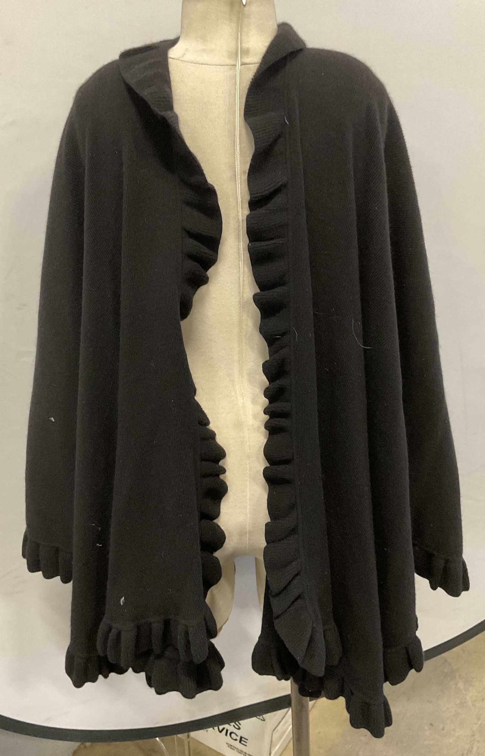 Saks Fifth Avenue Black Merino Wool Shawl: Saks Fifth Avenue black shawl with ruffle fringe. Merino wool and angora blend. Measures approx 75 inches wide. Some wear to material consistent with exposure. Saks fifth Avenue, Saks fifth Avenue sha