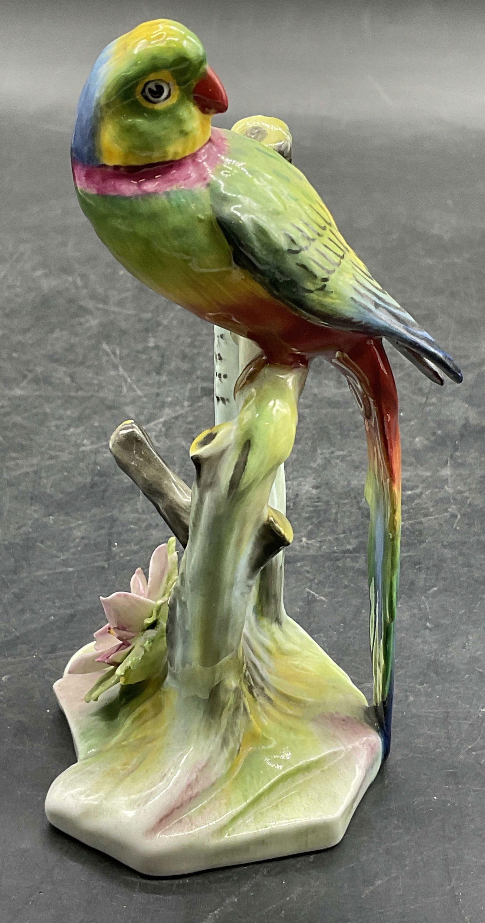 ROYAL ADDERLEY Bone China Parakeet Figural, Eng: ROYAL ADDERLEY Bone China Parakeet Figural. Underside signed ROYAL ADDERLEY Made in England Bone China Parakeet. Painted in multicolored hues. Measures approx. 5H x 2.5W in. Surface wear and rough edg