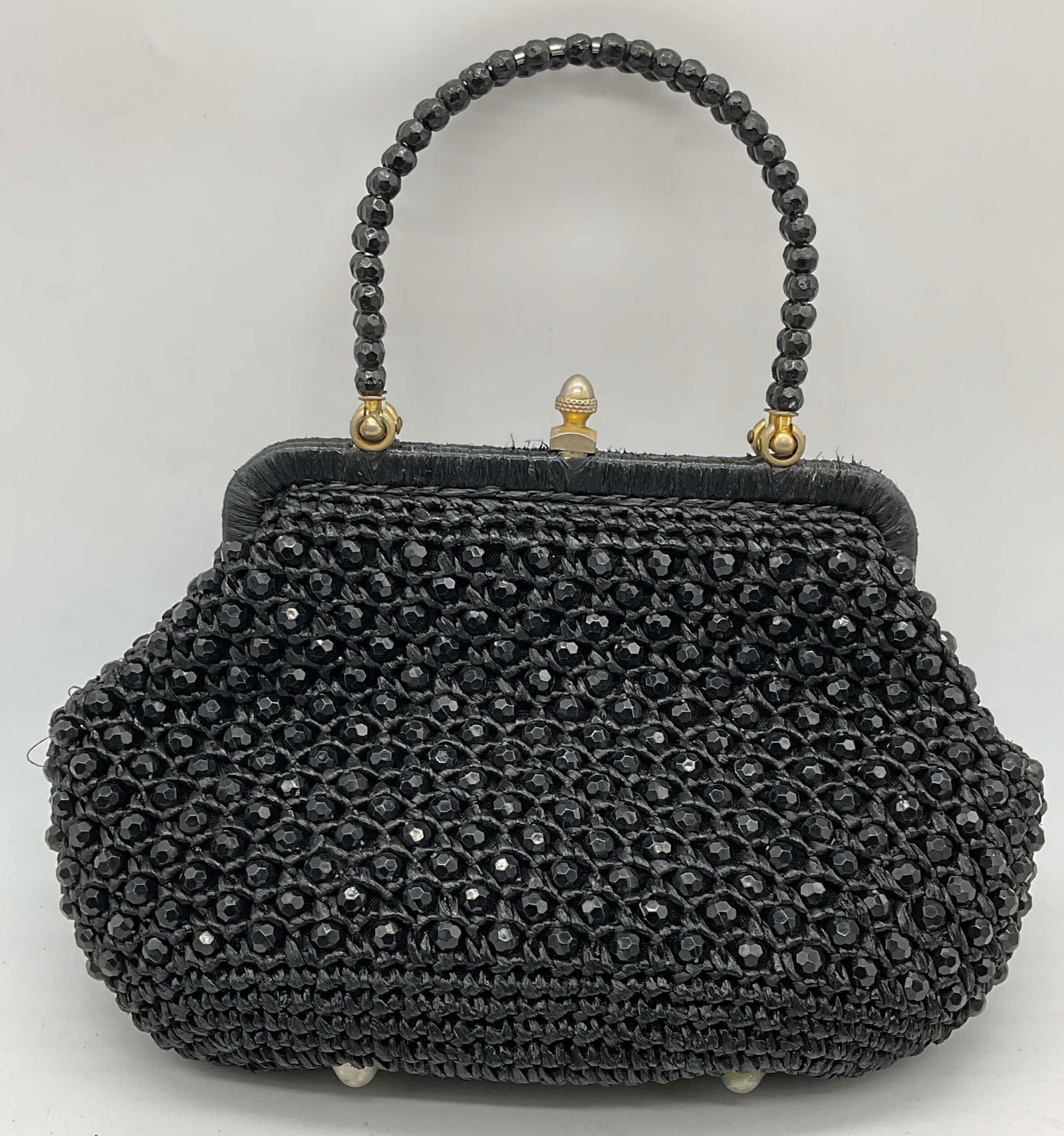 Vtg Bloomingdales Black Beaded Handbag Italy: Vintage Bloomingdales black straw handbag with black beaded crystal decoration. Made in Italy. Signed on interior. Measures approx. 10 x 3 x 6.5 inches. Wear including blemishes observed. Bloomingdale