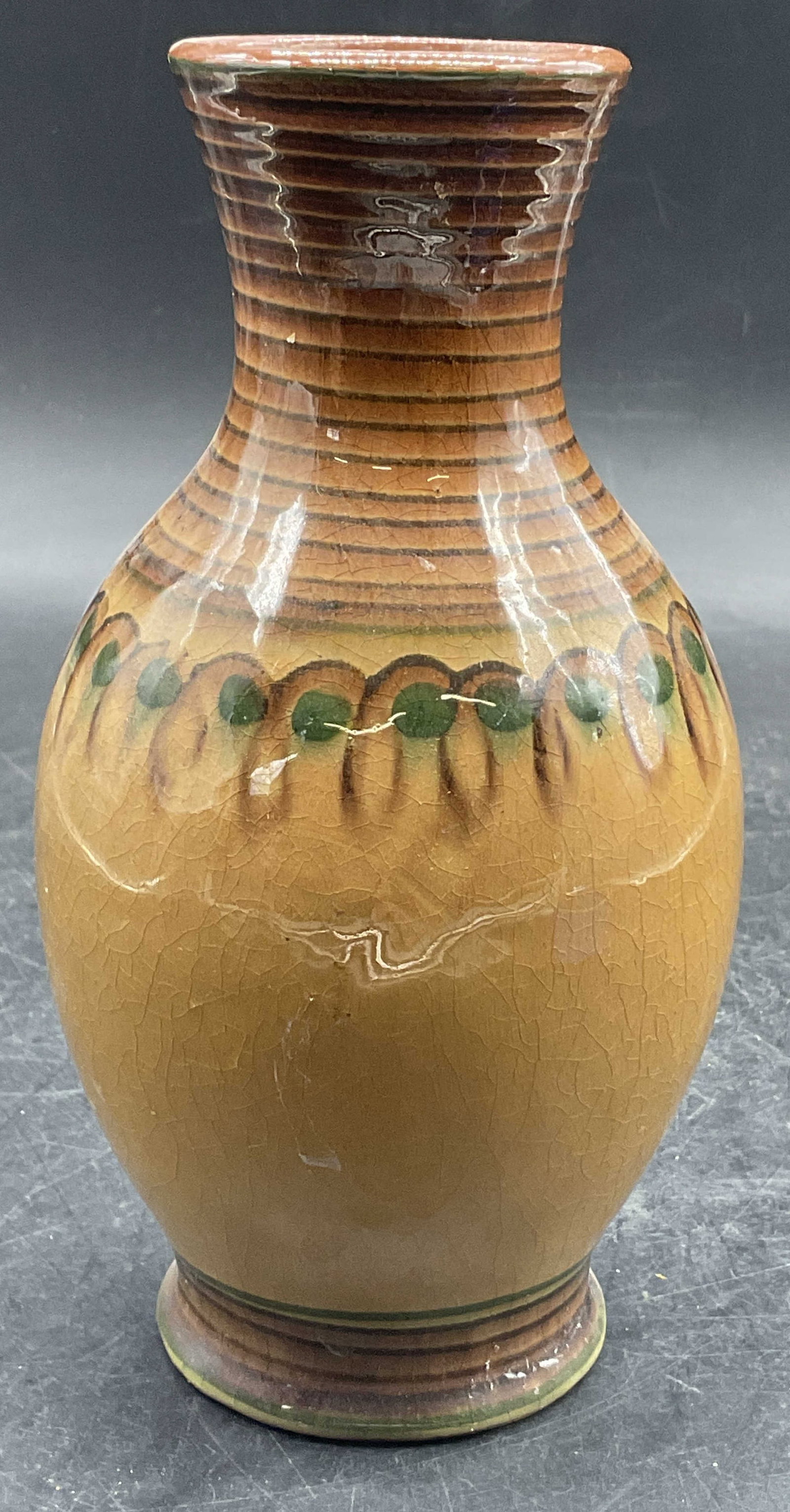 Vintage Handcrafted Artisan Glazed Pottery Vase: Vintage Handcrafted Artisan Glazed Pottery Vase. Measures approx. 6.75H x 3.5W in. Primarily brown and green hues. Crazing, pitting, discoloration, and residue present. home decor, home accents, homew