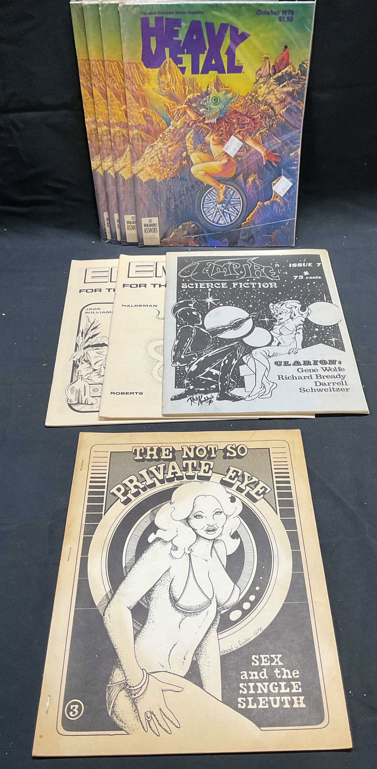 Lot Vintage Science Fict, Fantasy Magazines1978+: Group lot of softcover science fiction, fantasy, and adult magazines. Includes 4 copies Heavy Metal October, 1978 issue, Empire Science Fiction issue 7, 23, and 24, and the Not So Private Eye issue 3.