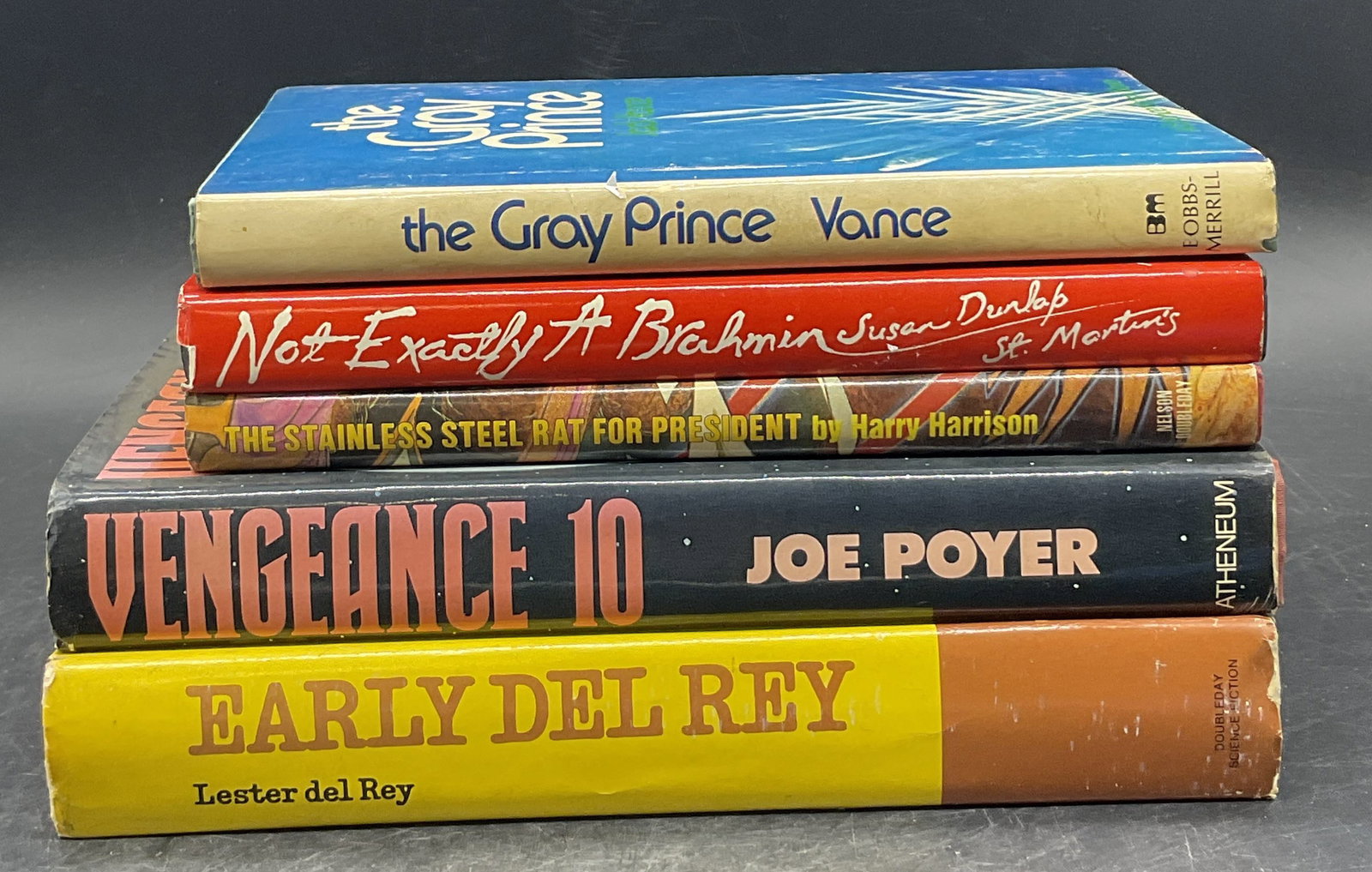 Lot 5 Vintage Books, First Printing & More 1974+: A group lot of five hardcover vintage books. Titles include: 1975 Early del Rey by Lester Del Rey, 1982 THE STAINLESS STEEL RAT FOR PRESIDENT by Harry Harrison, First Printing 1974 The Gray Prince by 