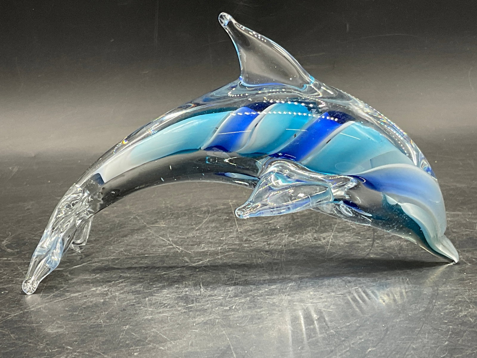 Blue Swirl Art Glass Dolphin Figural: Blue Swirl Art Glass Dolphin Figural. Measures approx. 4H x 6.25W in. Bubbles to glass. Surface wear consistent with age, use, and exposure. home decor, home accents, homewares, housewares, home acces