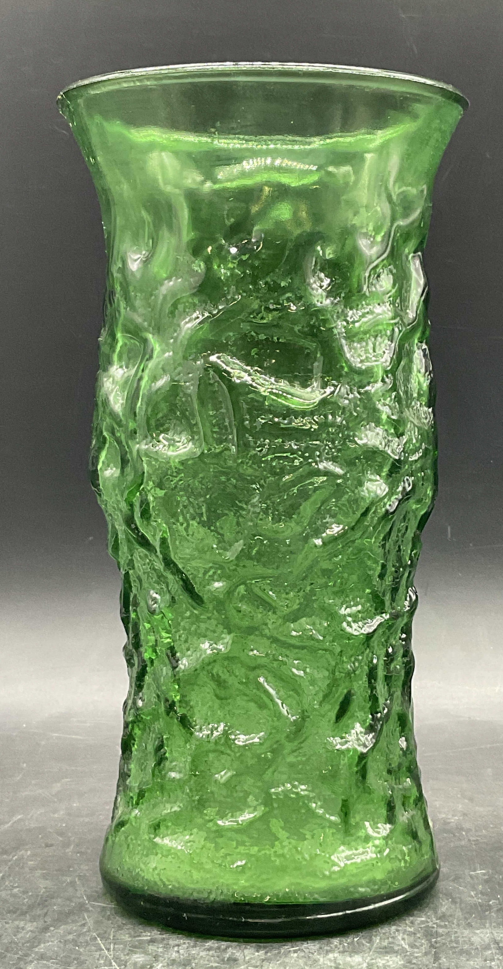 E.O. BRODY Vintage Green Glass Vase: E.O. BRODY Vintage Green Glass Vase. Textured vase. Underside reads E.O. BRODY. Measures approx. 9.5H x 4.75W in. Surface wear and chipping. Seam present. home decor, home accents, homewares, housewar