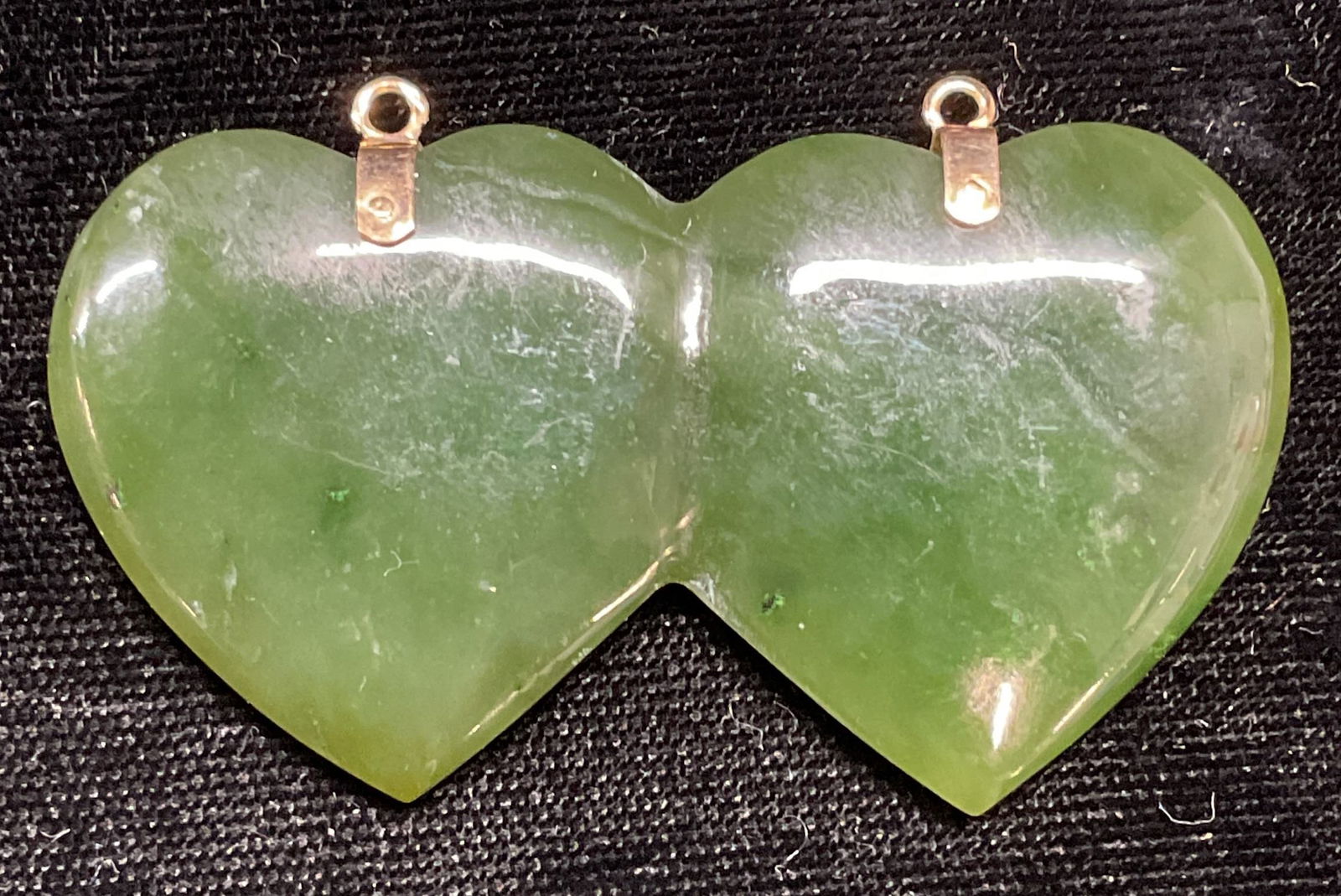 Carved Double Heart Jade Pendant: Carved double heart motif jade pendant. Measure approx. 2.25 x 1.25 inches. Some scratching observed. Jewelry, estate jewelry, fine jewelry, cocktail jewelry, fashion jewelry, accessories, fashion acc