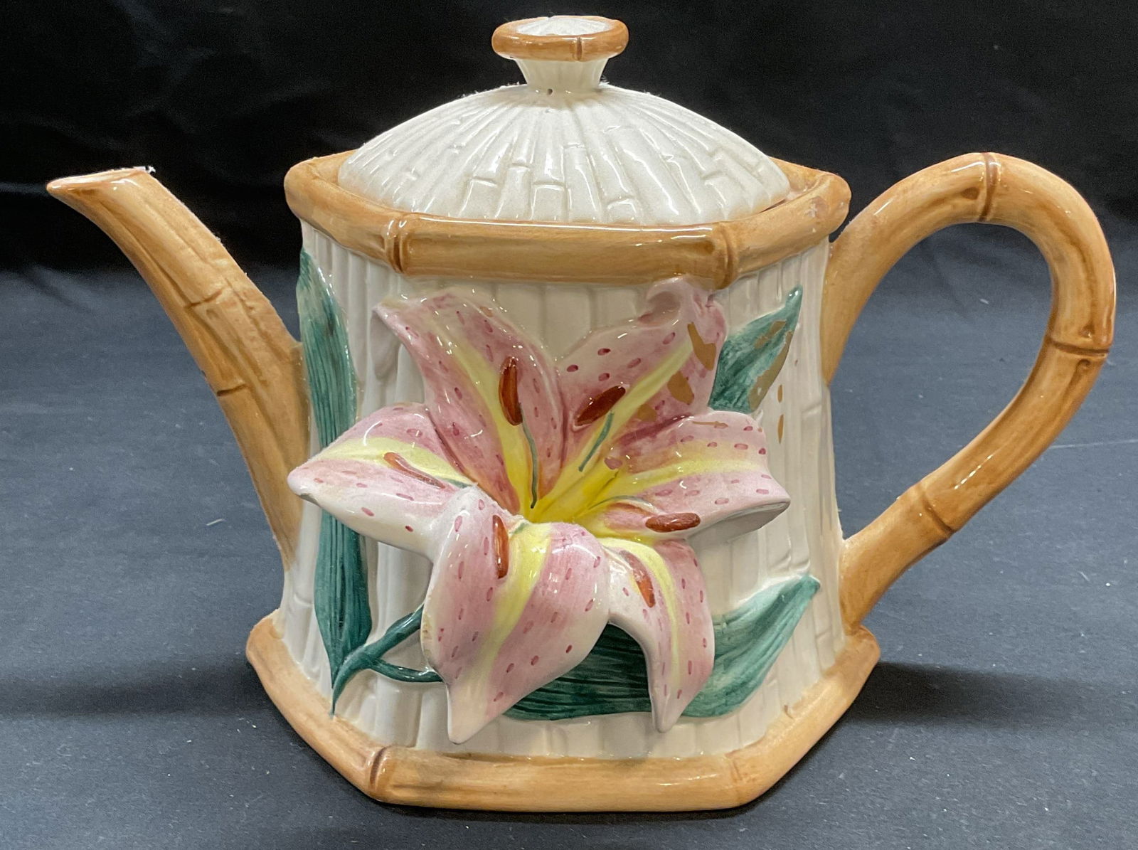 1991 Fitz & Floyd Porcelain Lily Bamboo Tea Pot: Vintage 1991 Fitz and Floyd porcelain teapot with Lily and bamboo motif. Hand painted. Signed on underside. Measures approx 9.5 x 6 x 6.5 inches. Some wear including scratching and small chips. Fitz a
