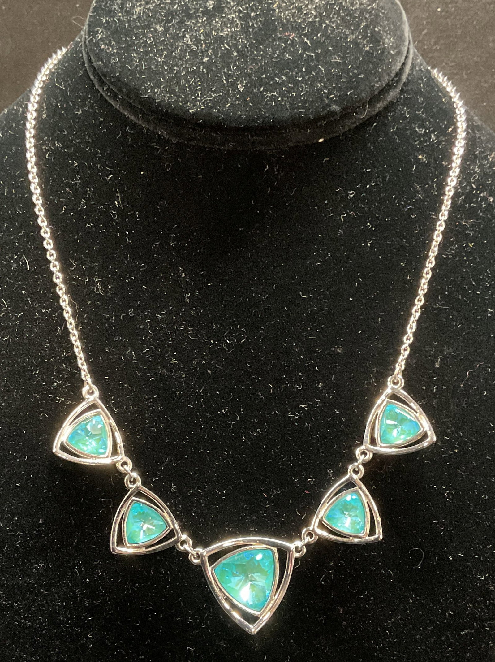 Swarovski Touchstone Crystal Pendant Necklace: Touchstone by Swarovski necklace. Silver tone with blue Swarovski crystal pendants. Signed on hang tag. Drop length approx 8.5 inches. Includes box. Some wear including scratching observed. Jewelry, e