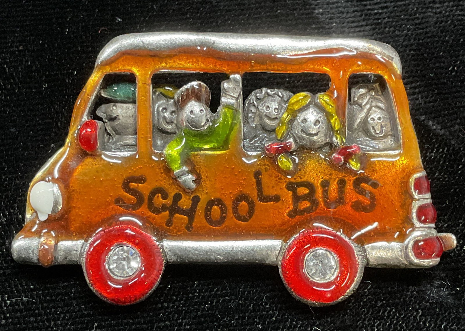Vintage AJMC Enamel School Bus Brooch: Vintage AJMC Orange enamel school but motif brooch. Signed on underside. Hinge pin on underside. Measures approx 1.25 x 2 inches. Some wear including scratching observed. Jewelry, estate jewelry, cost